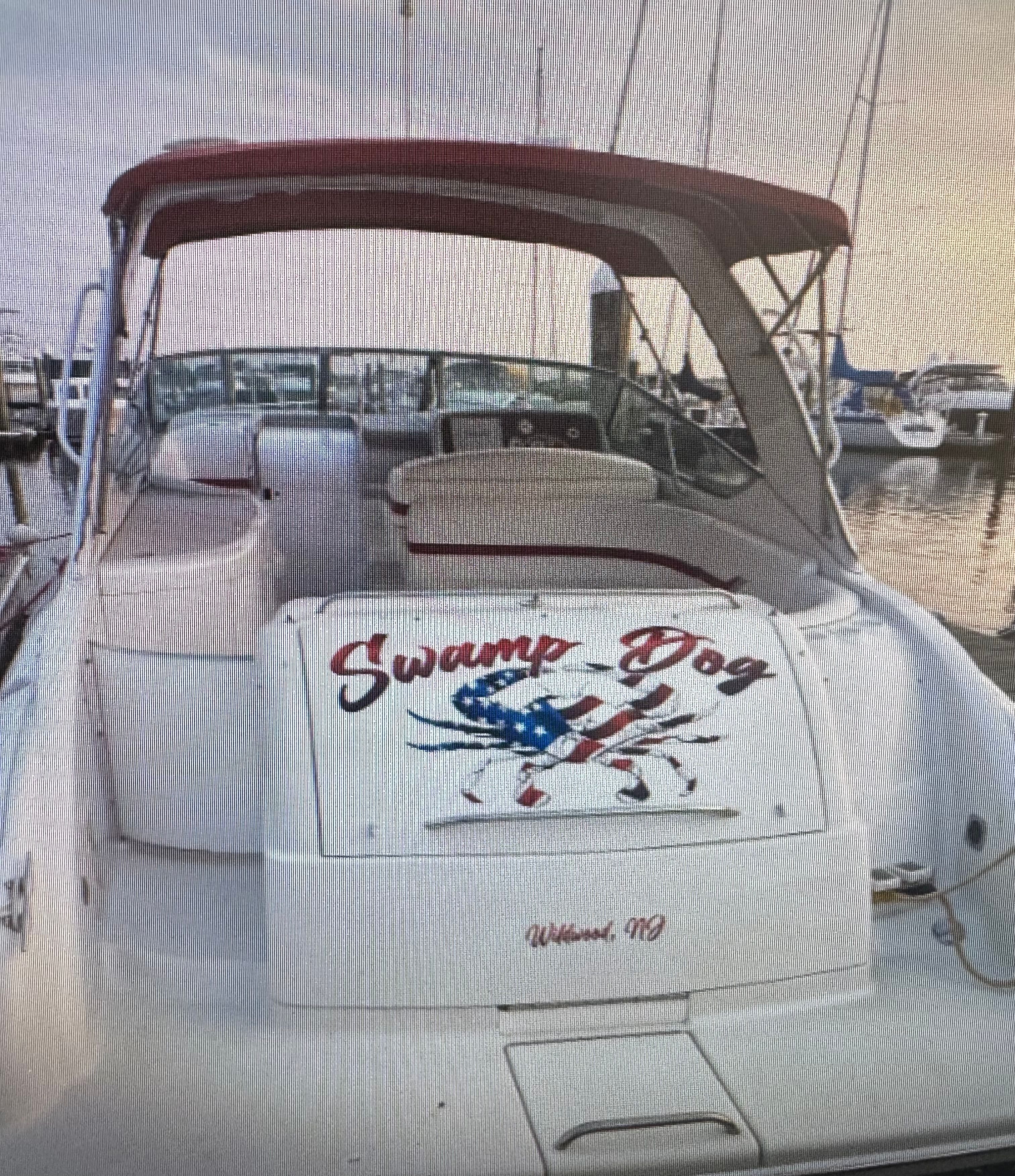 2001 Formula 37 Super Sport boat with "Swamp Dog" lettering at the dock.