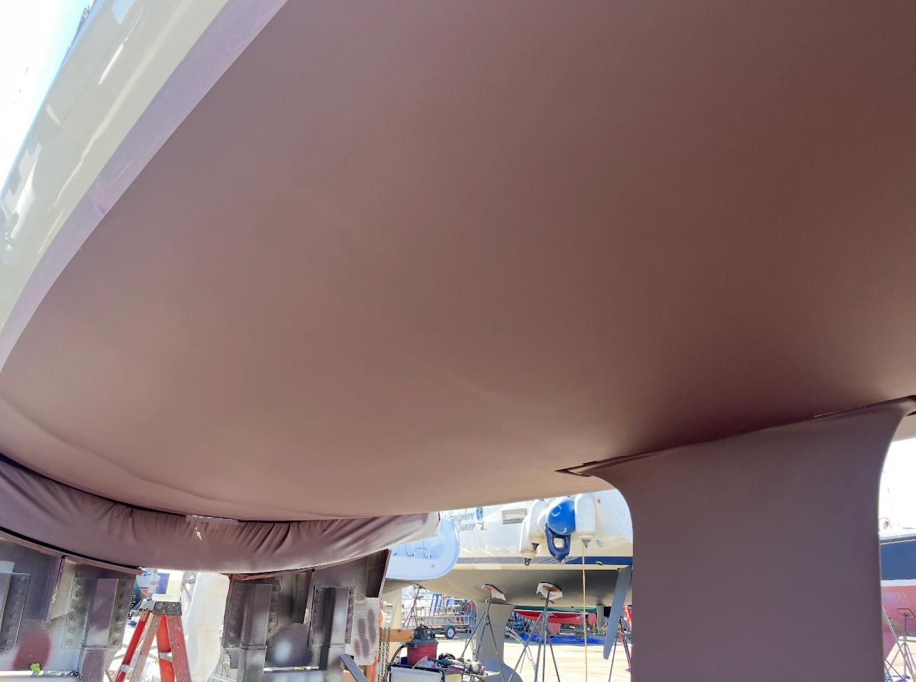Bottom view of a 2018 Seascape 27 sailboat hull in a boatyard.