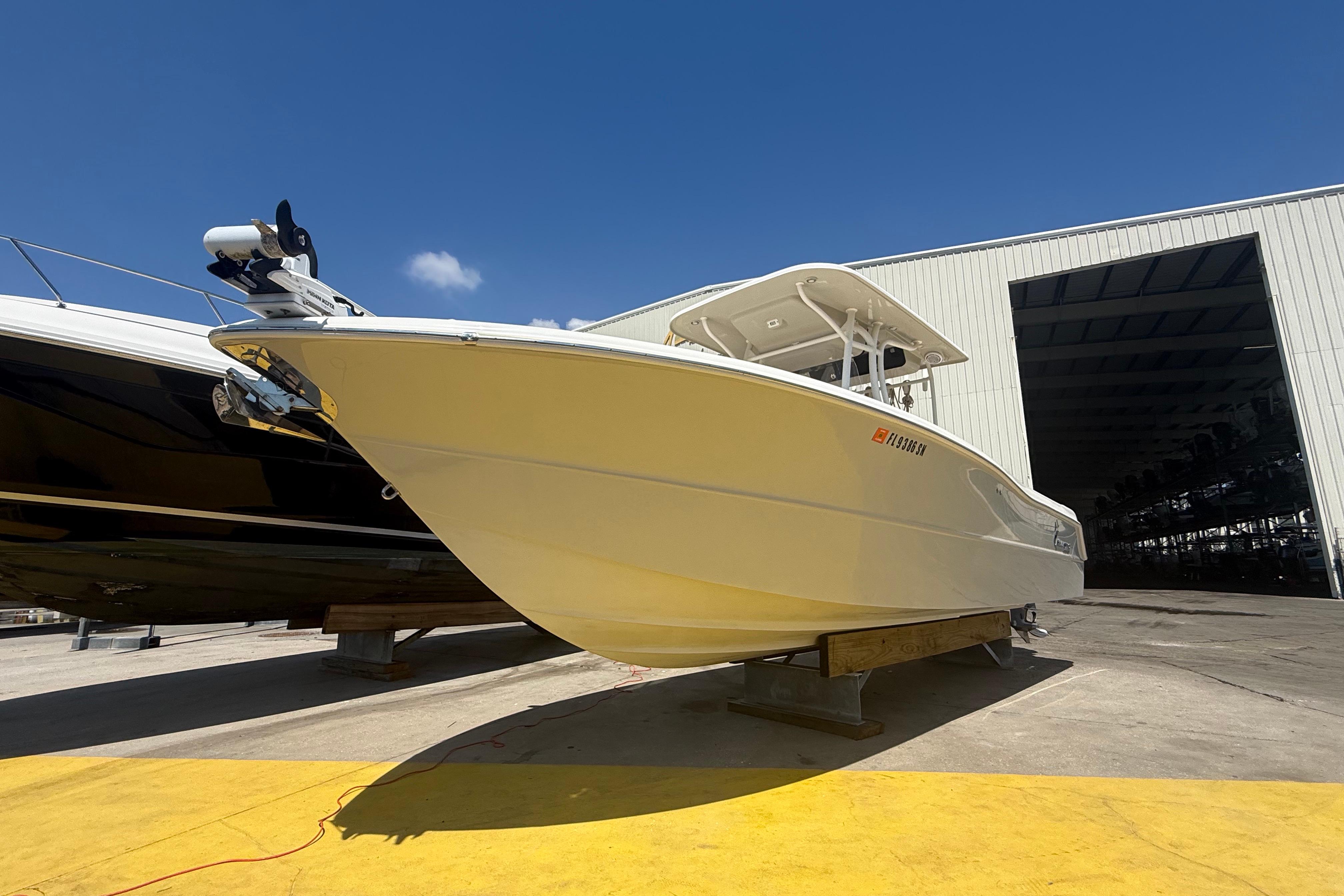 2019 Key West Billistic 281 Center Console boat on display outside a warehouse.