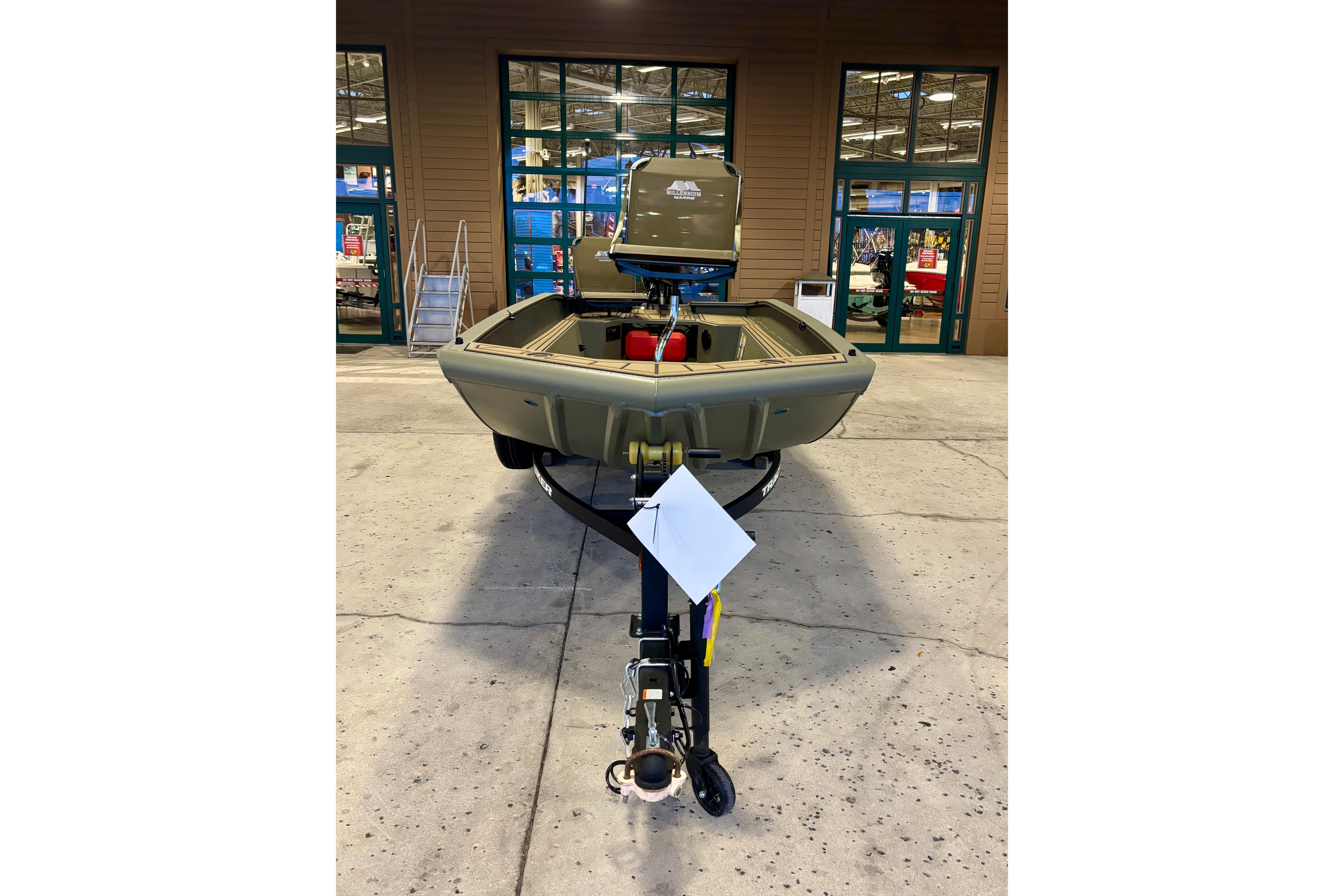 2026 Tracker Grizzly 1650 T Prairie Wings Edition boat displayed indoors.