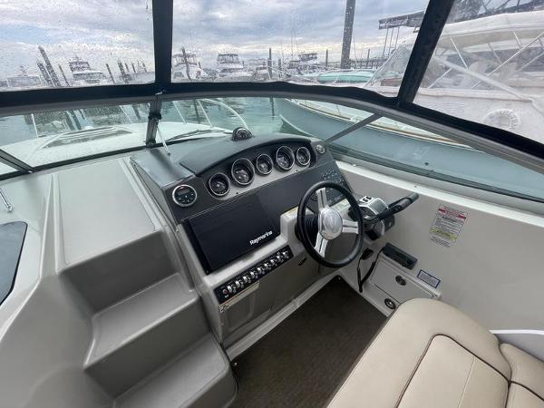2014 Sea Ray 310 Sundancer helm with modern controls and navigation system.