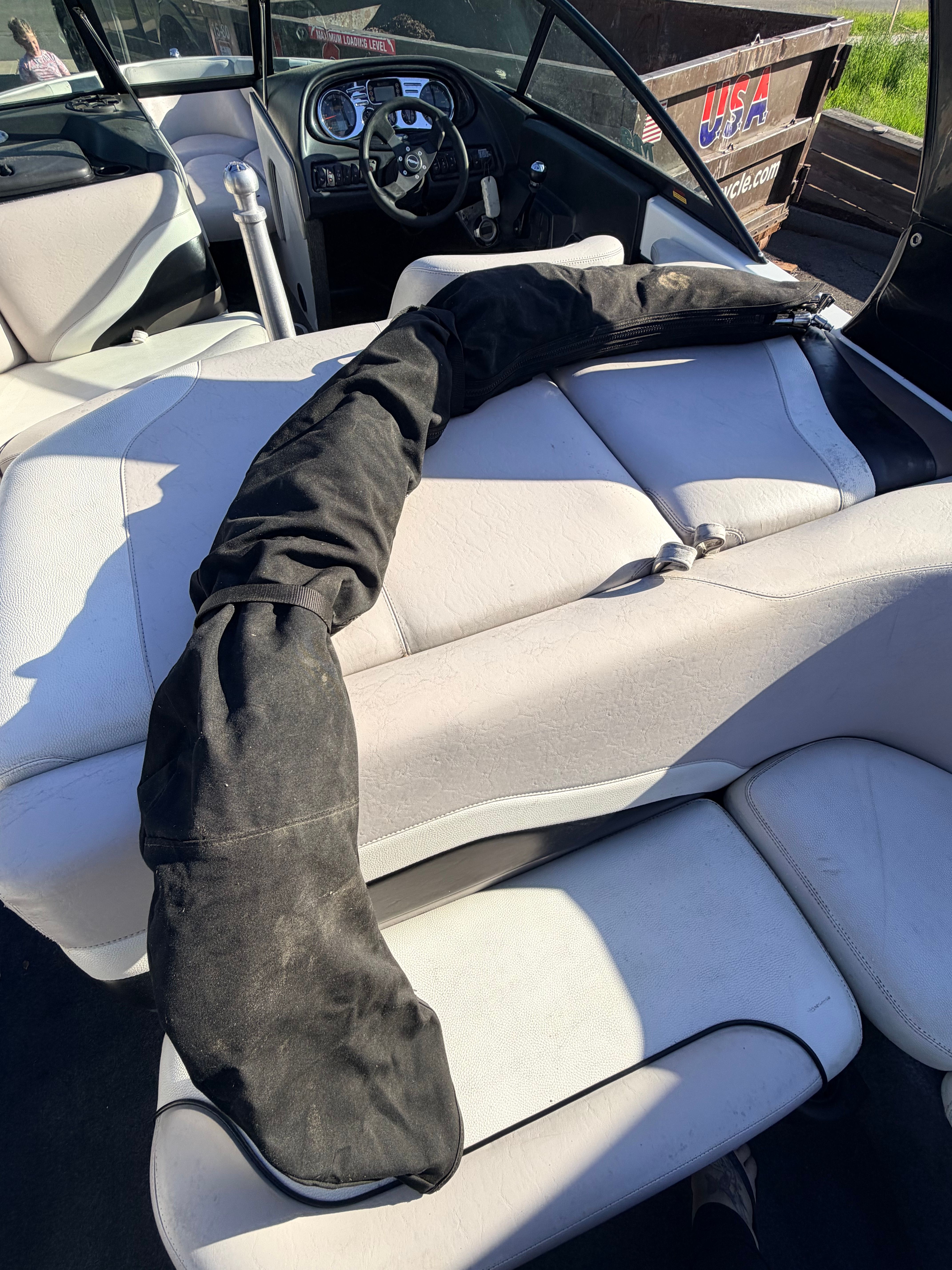 Interior of a 2006 Malibu iRide boat with black cover.