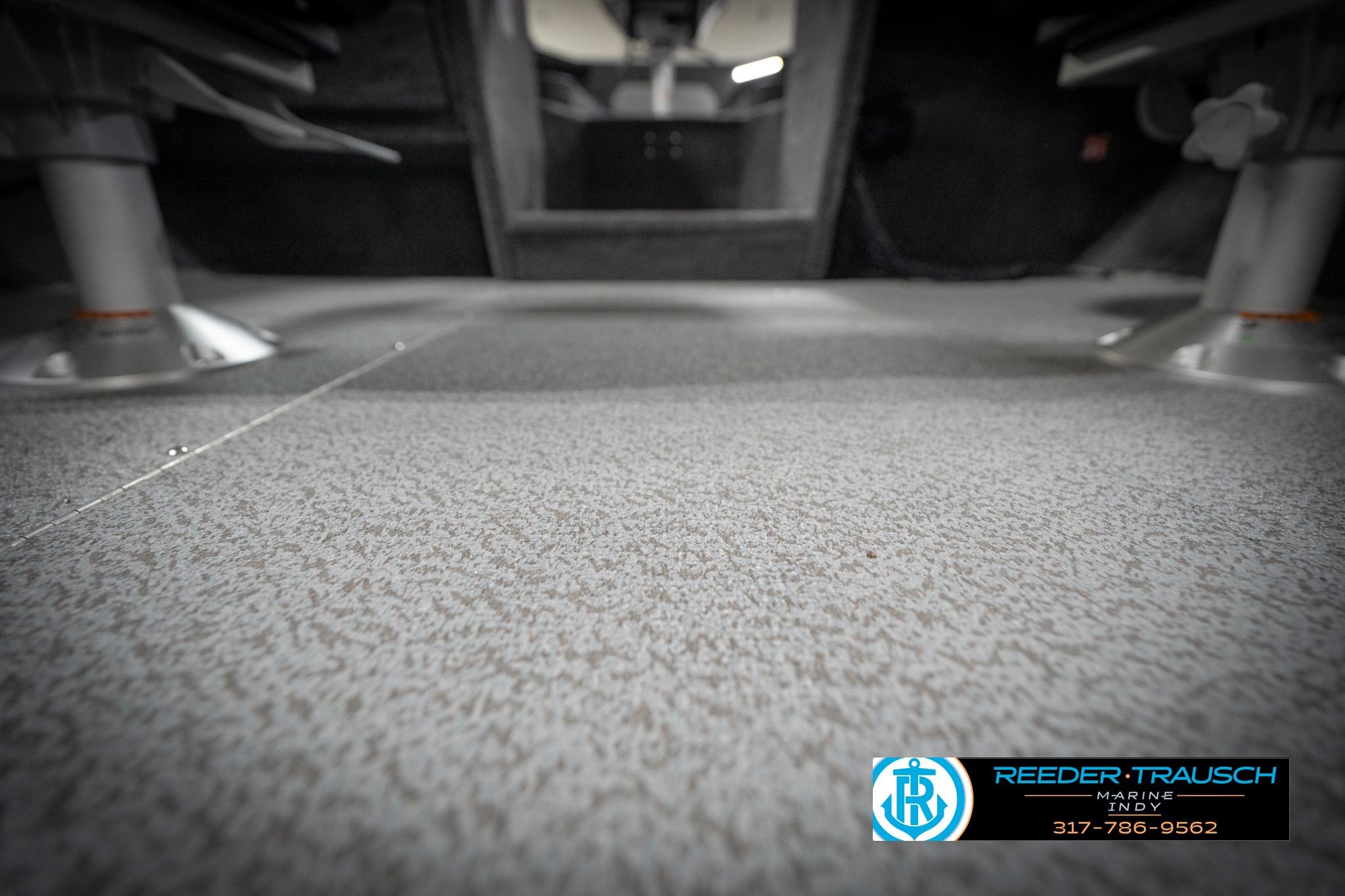2026 Lund 2275 Baron boat interior flooring, featuring textured surface and seating mounts.