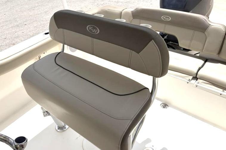 2023 Key West 203 FS boat seating with beige upholstery and KW logo.