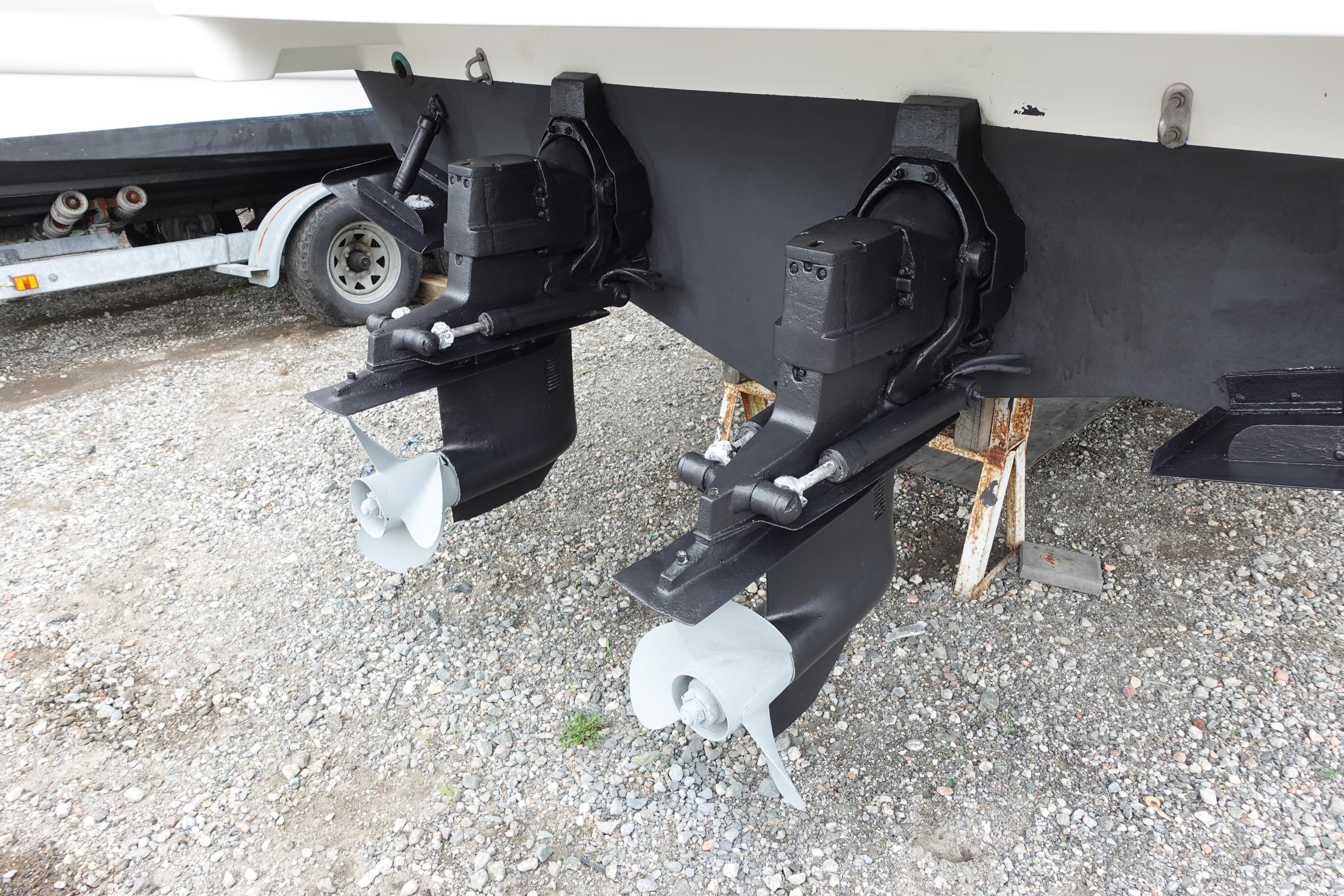 1993 Formula 34 Performance Cruiser dual propellers on gravel surface.