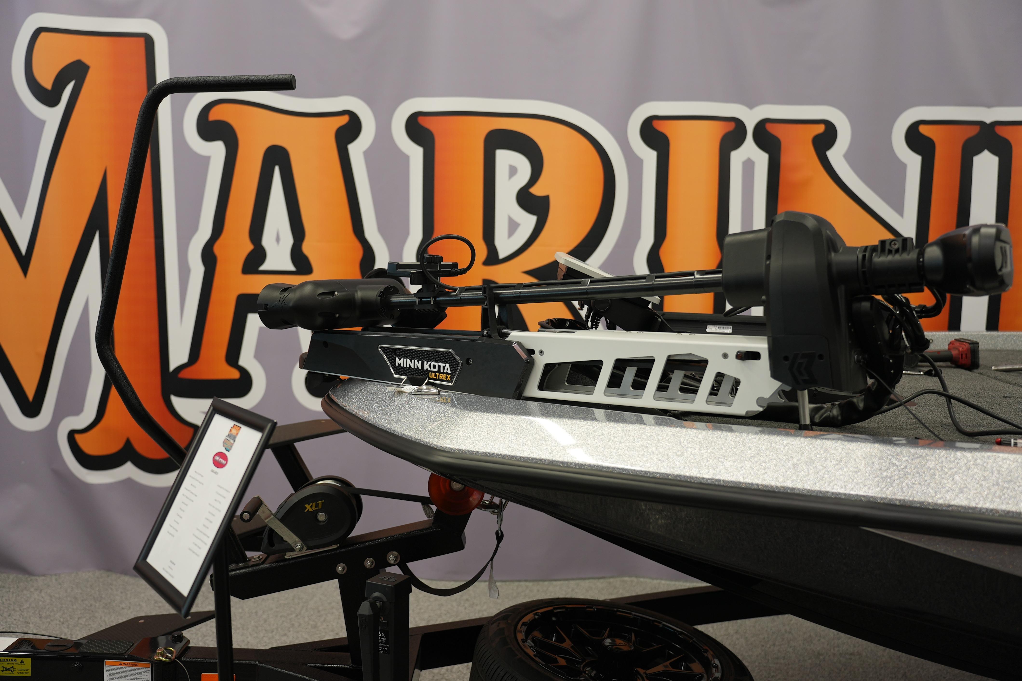 2026 iKon LXE20 boat with Minn Kota Ultrex motor displayed at a marine exhibition.