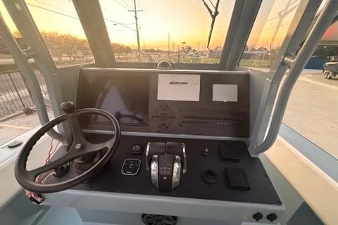 Control panel of a 2019 Metal Shark 28 CC boat at sunset.