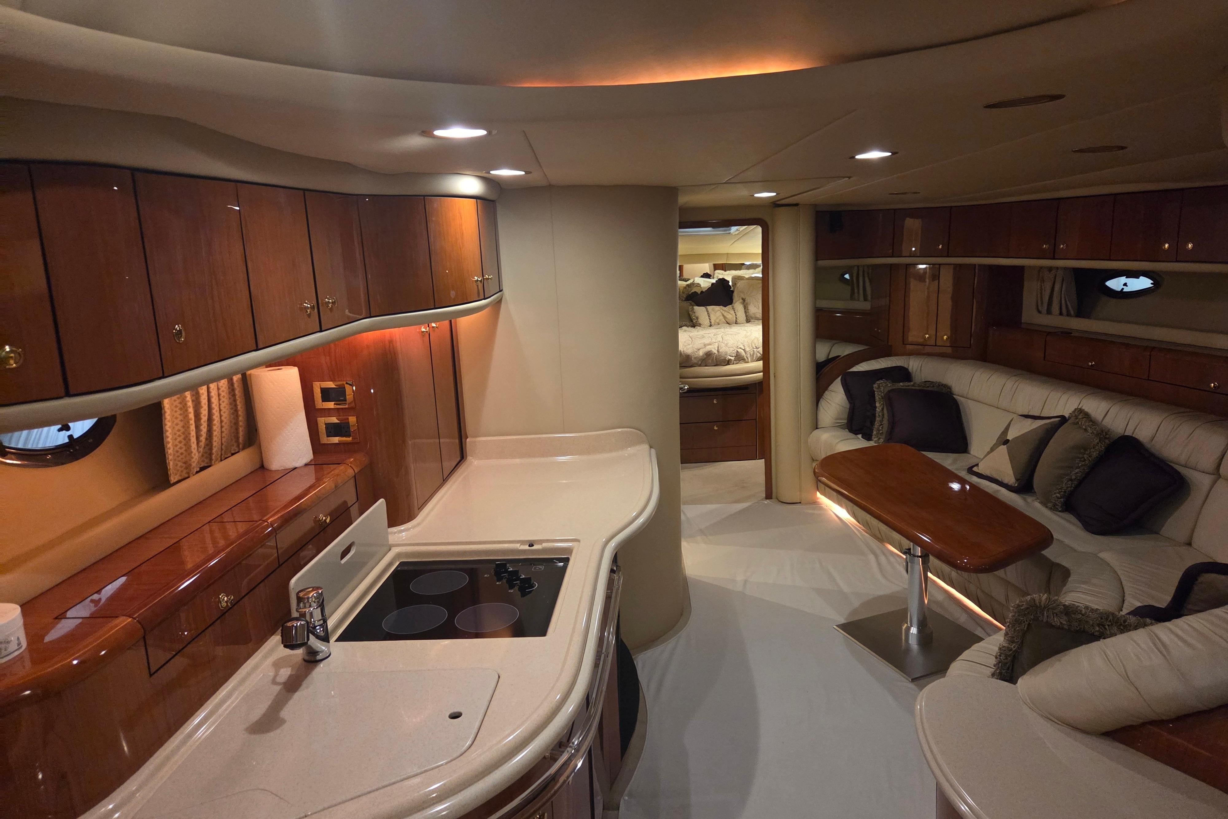 Luxurious interior of a 2000 Sea Ray Sundancer 540 yacht with elegant wood finishes.