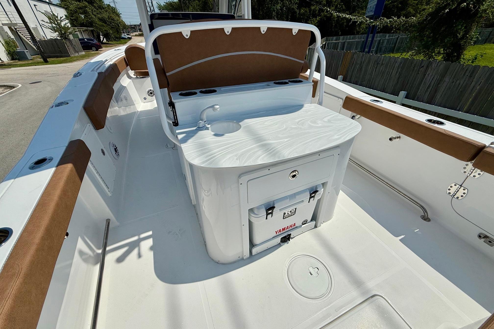 2026 Sea Hunt Ultra 305 SE boat interior with seating and storage.