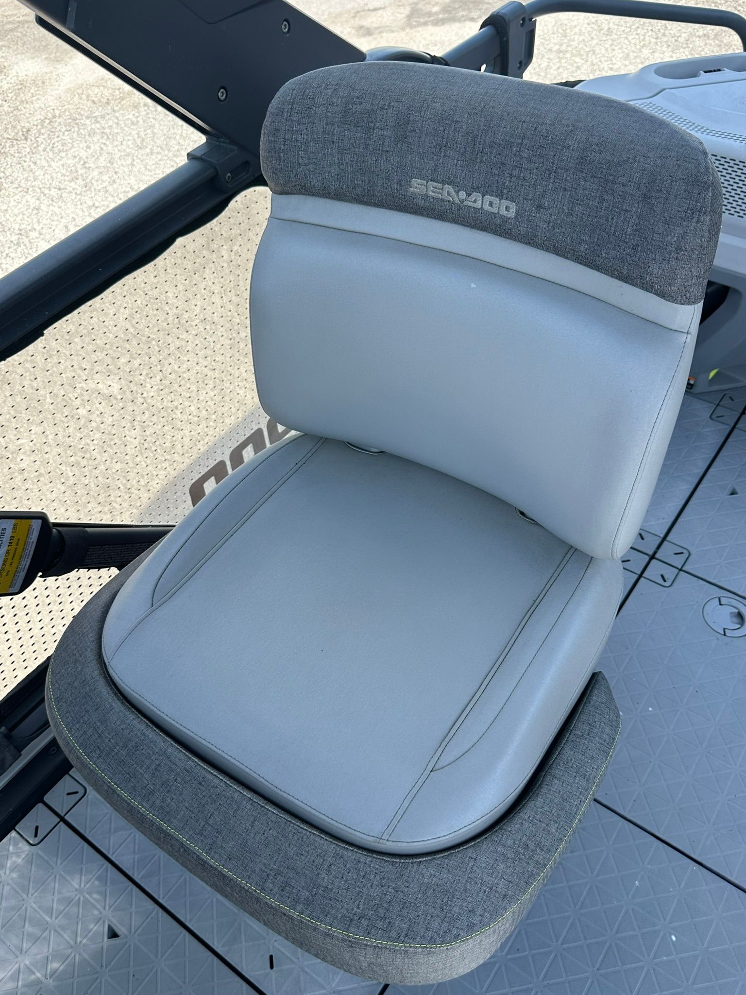 A gray and white seat on a 2023 Sea-Doo 21 SWITCH SPORT.