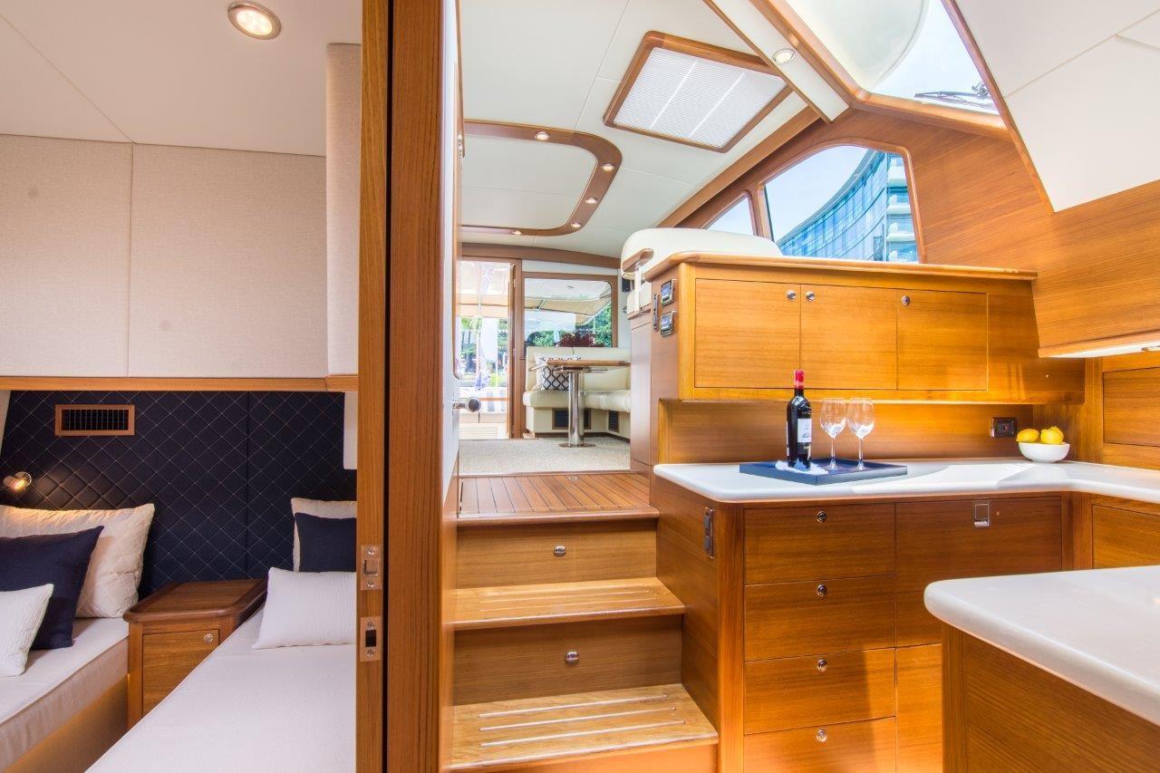 Luxurious interior of 2026 Palm Beach Motor Yachts PB52, featuring elegant wood finishes and modern design.