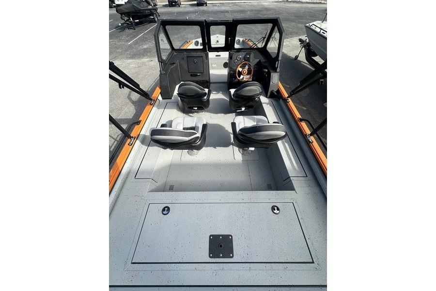 2026 SeaArk ProCat 240 boat interior with four seats and steering console.