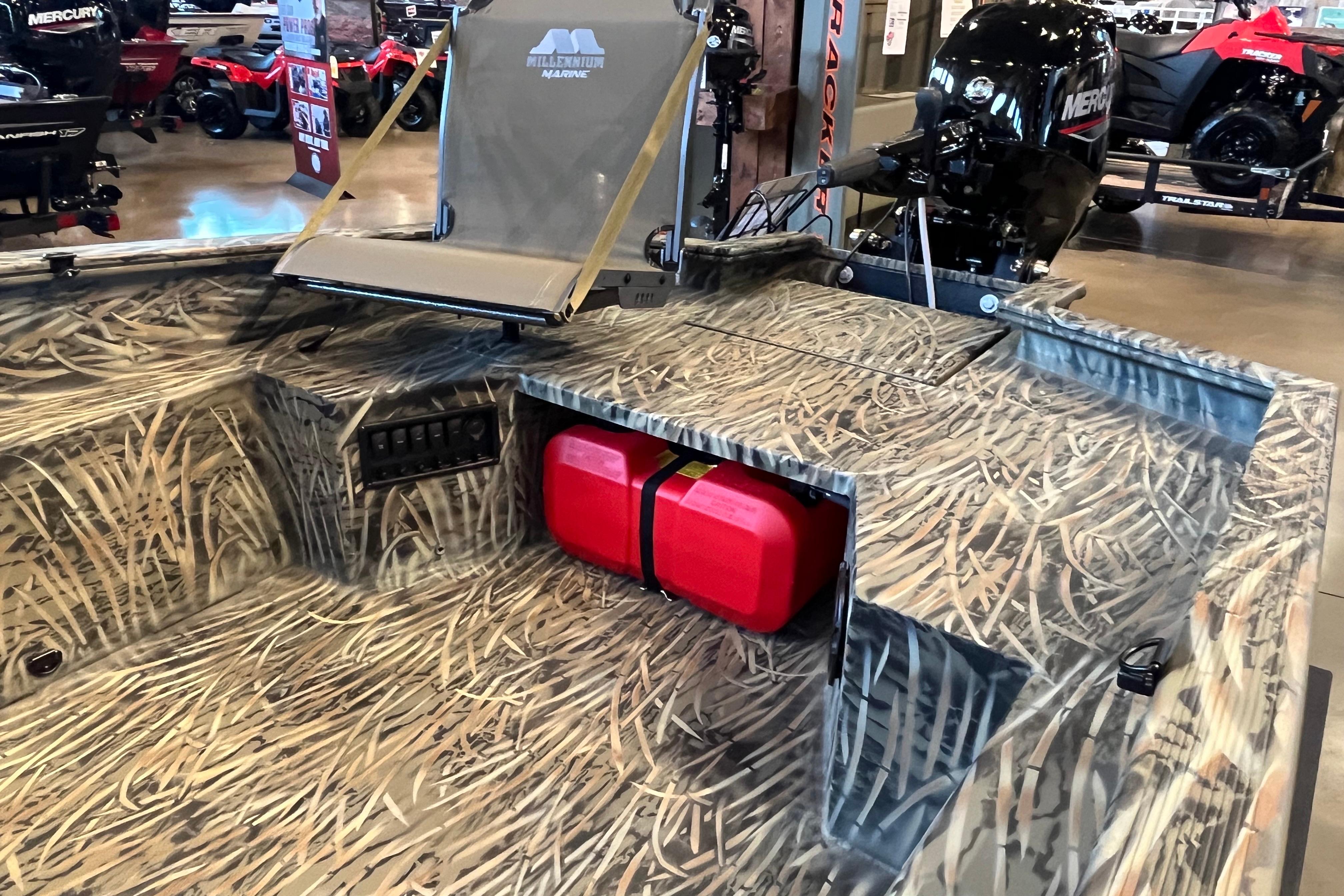 2026 Tracker Grizzly 1650 T Prairie Wings Edition boat with camo design and red fuel tank.