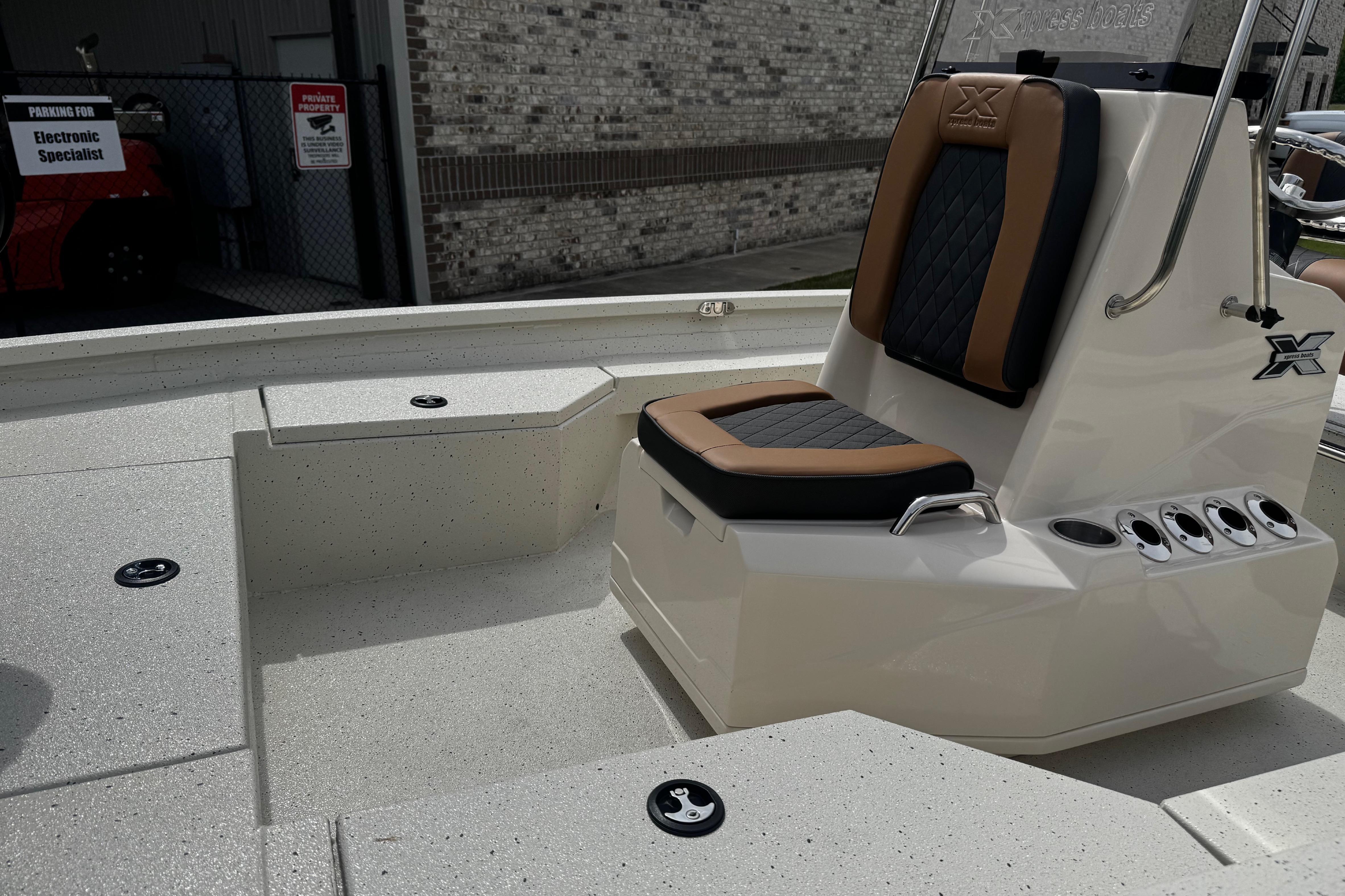 2026 Xpress H20B Bay boat interior with cushioned seating and sleek design.