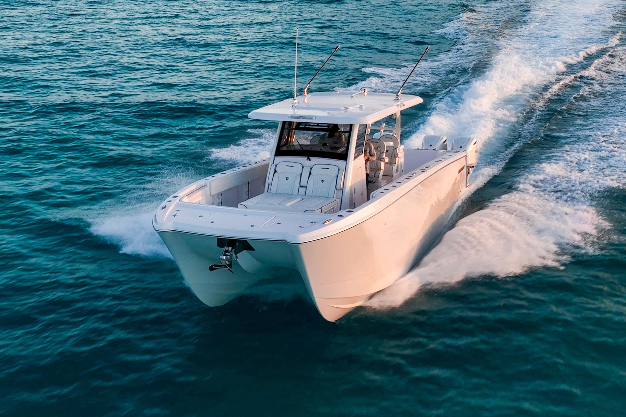 2026 Twin Vee 400 GFX2 CC cruising on open water, showcasing sleek design and performance.