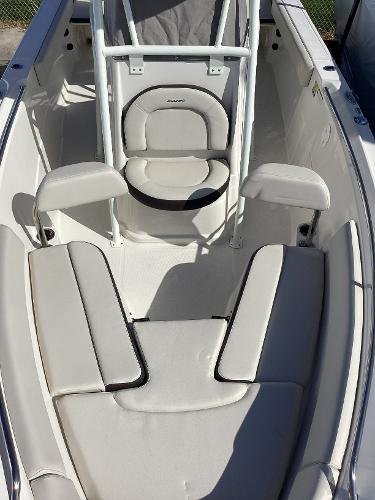 2022 Sailfish 220 CC boat interior with cushioned seating and white upholstery.
