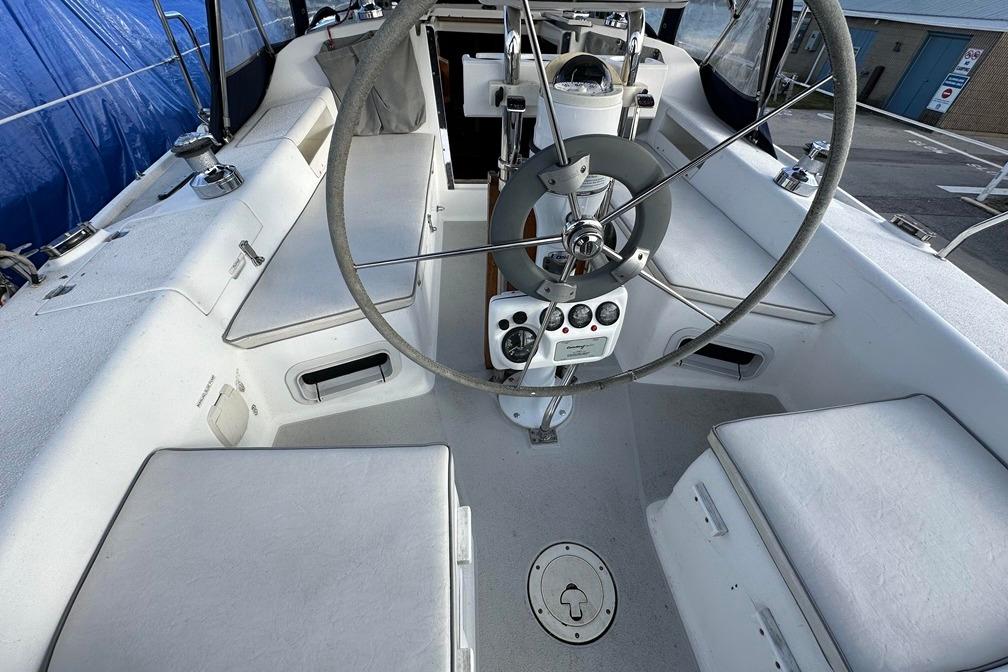 Cockpit of 2005 Catalina 28 MkII sailboat with steering wheel and seating.