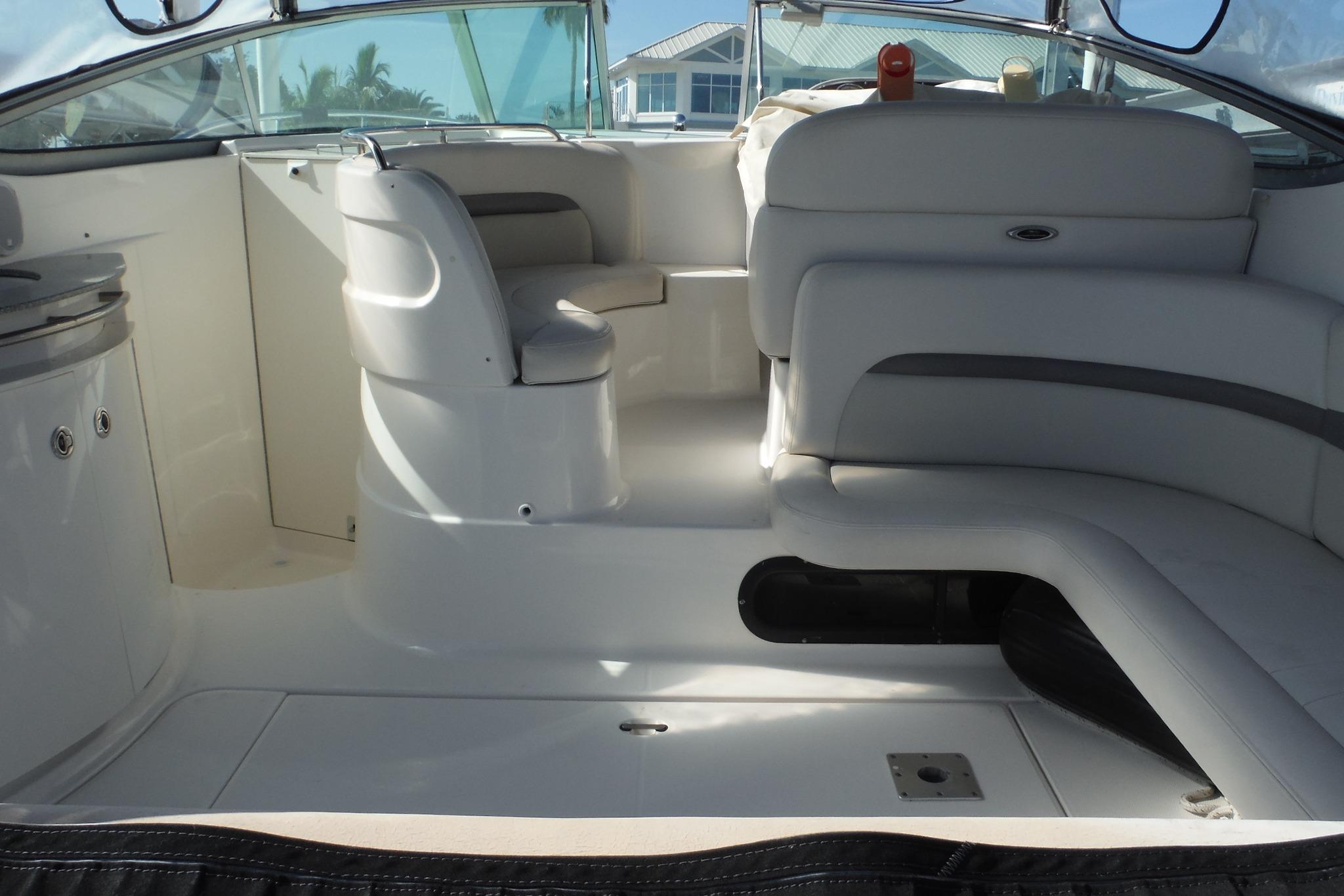 2005 Chaparral Signature 350 boat interior with white seating and helm station.