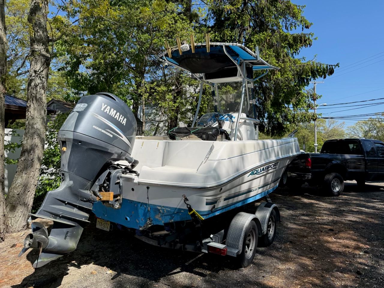 2005 Aquasport 210 Osprey boat with Yamaha engine on trailer.
