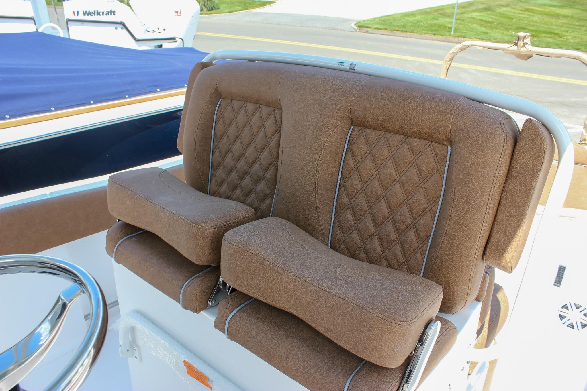 Brown leather seats on a 2027 Sea Hunt Ultra 234 boat.