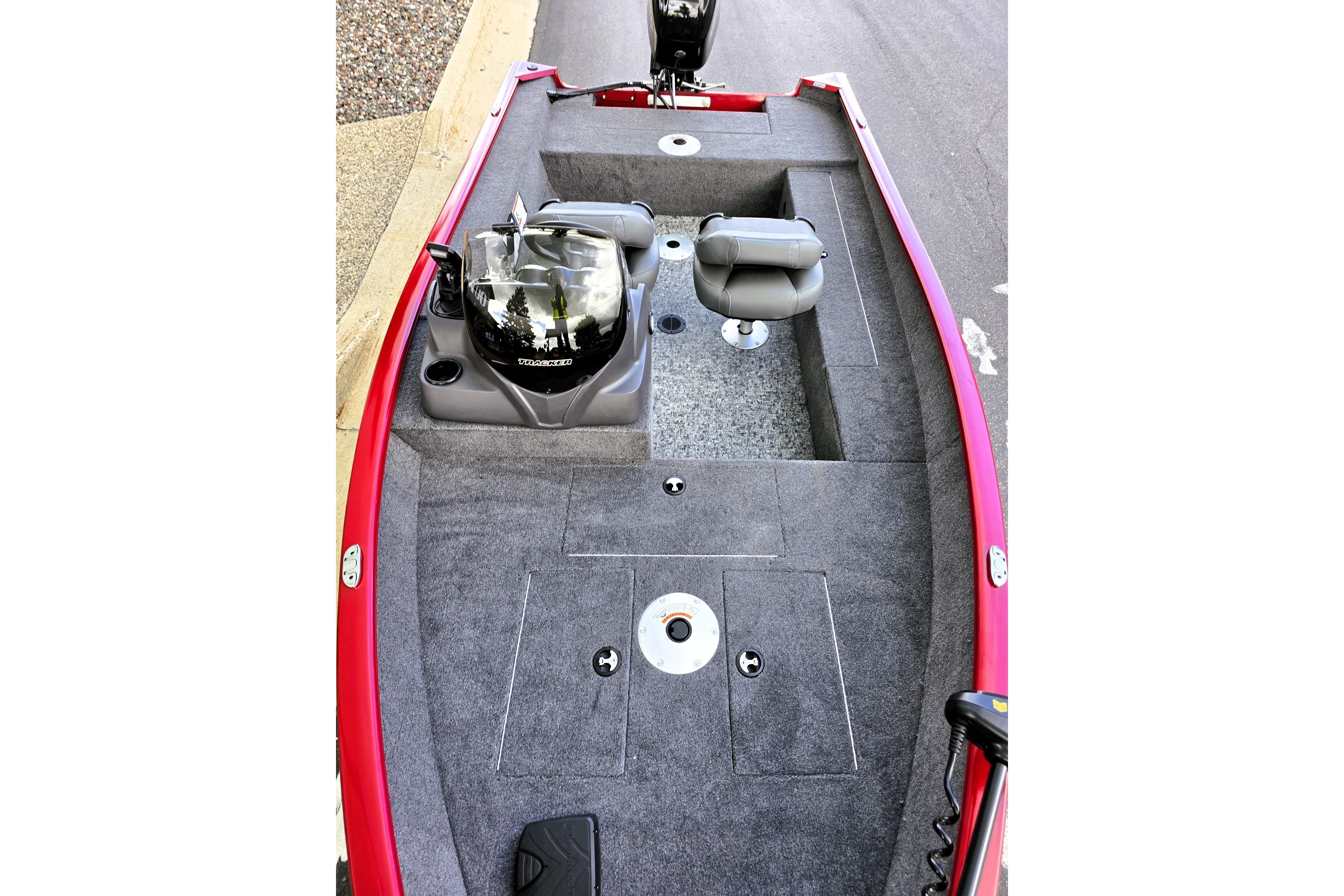 2026 Tracker Super Guide V-16 SC boat interior with gray carpet and seating.