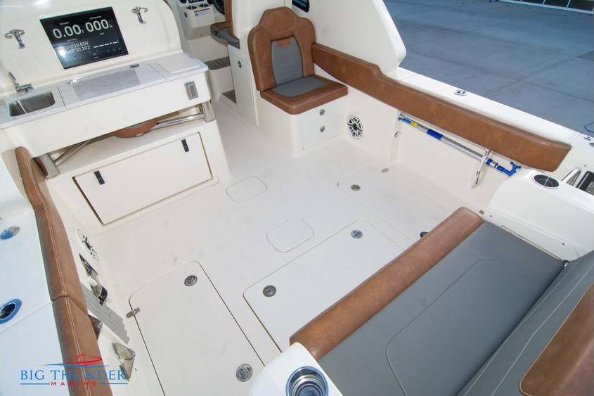 2022 Scout 350 LXZ boat interior with brown seating and modern dashboard.