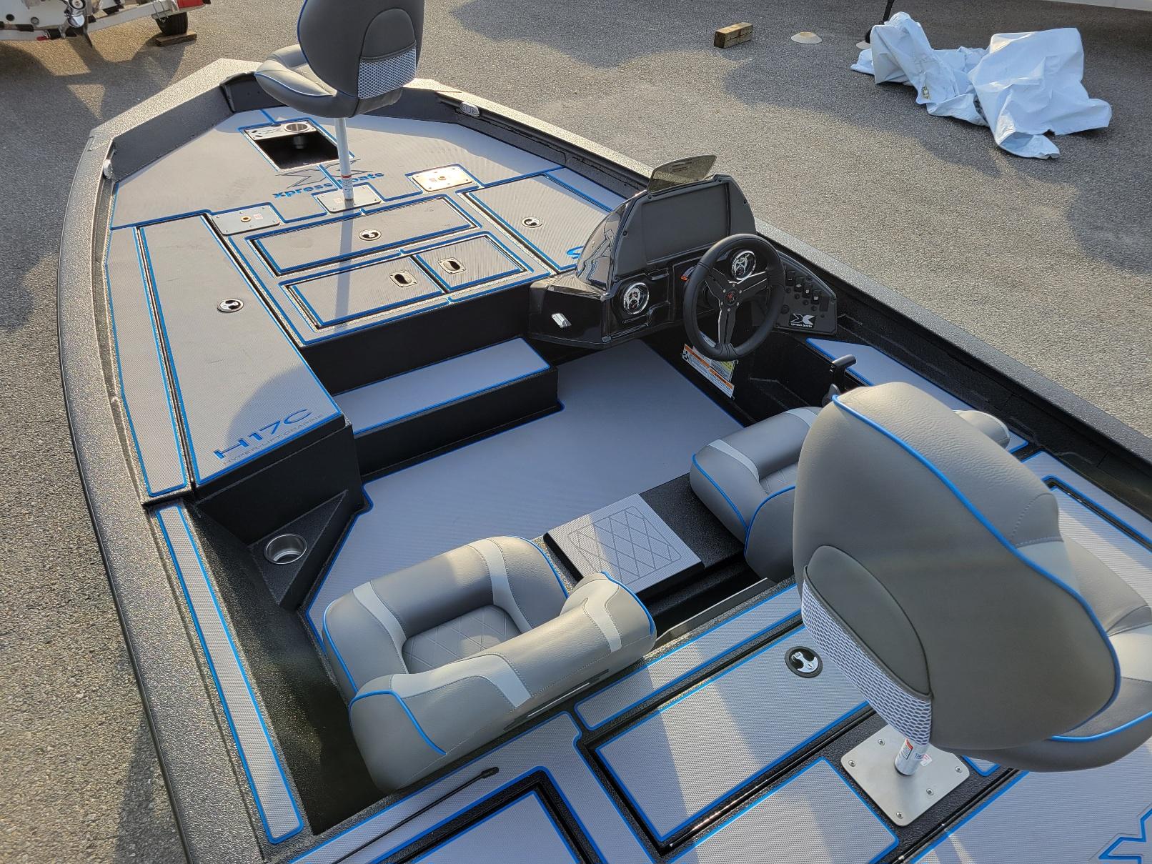 2025 Xpress H17C Crappie boat interior with seating and steering console, in stock.