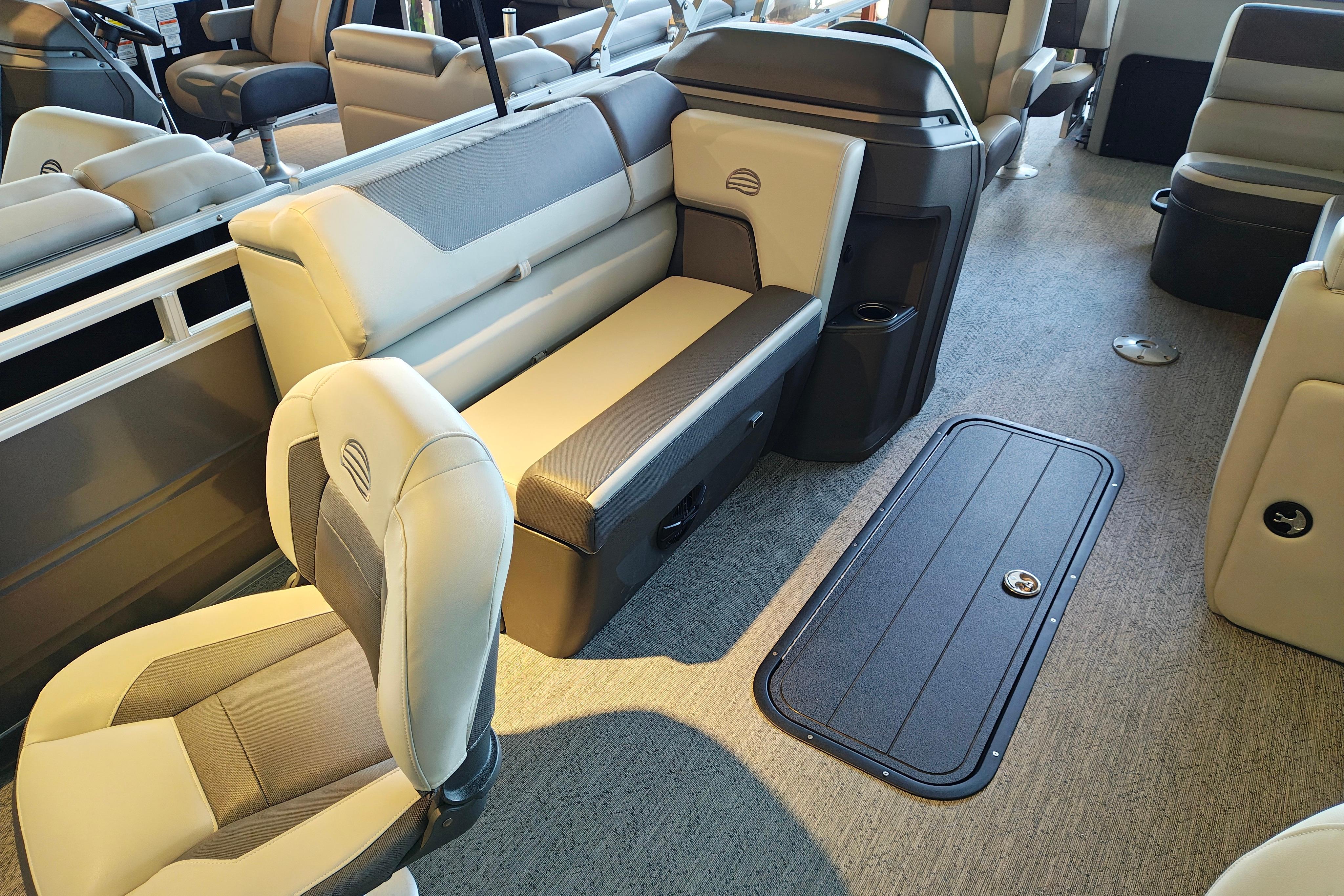 Interior of 2026 Sun Tracker Fishin' Barge 22 XP3, featuring comfortable seating and modern design.