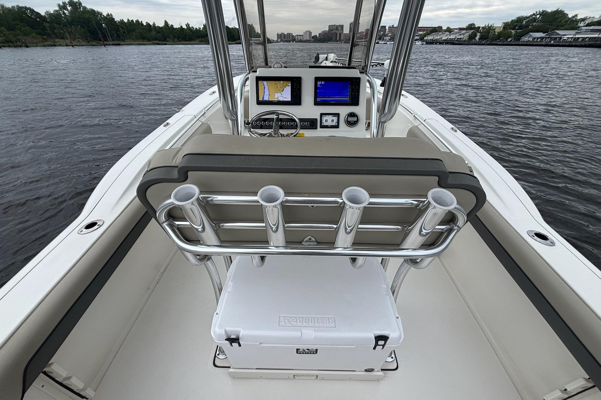 2025 Key West 244 Center Console boat interior with navigation screens on a calm river.