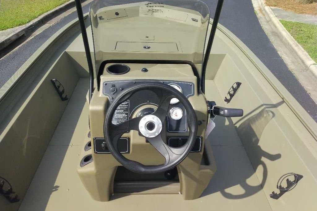 2026 Tracker Grizzly 1860 CC boat console with steering wheel and controls.