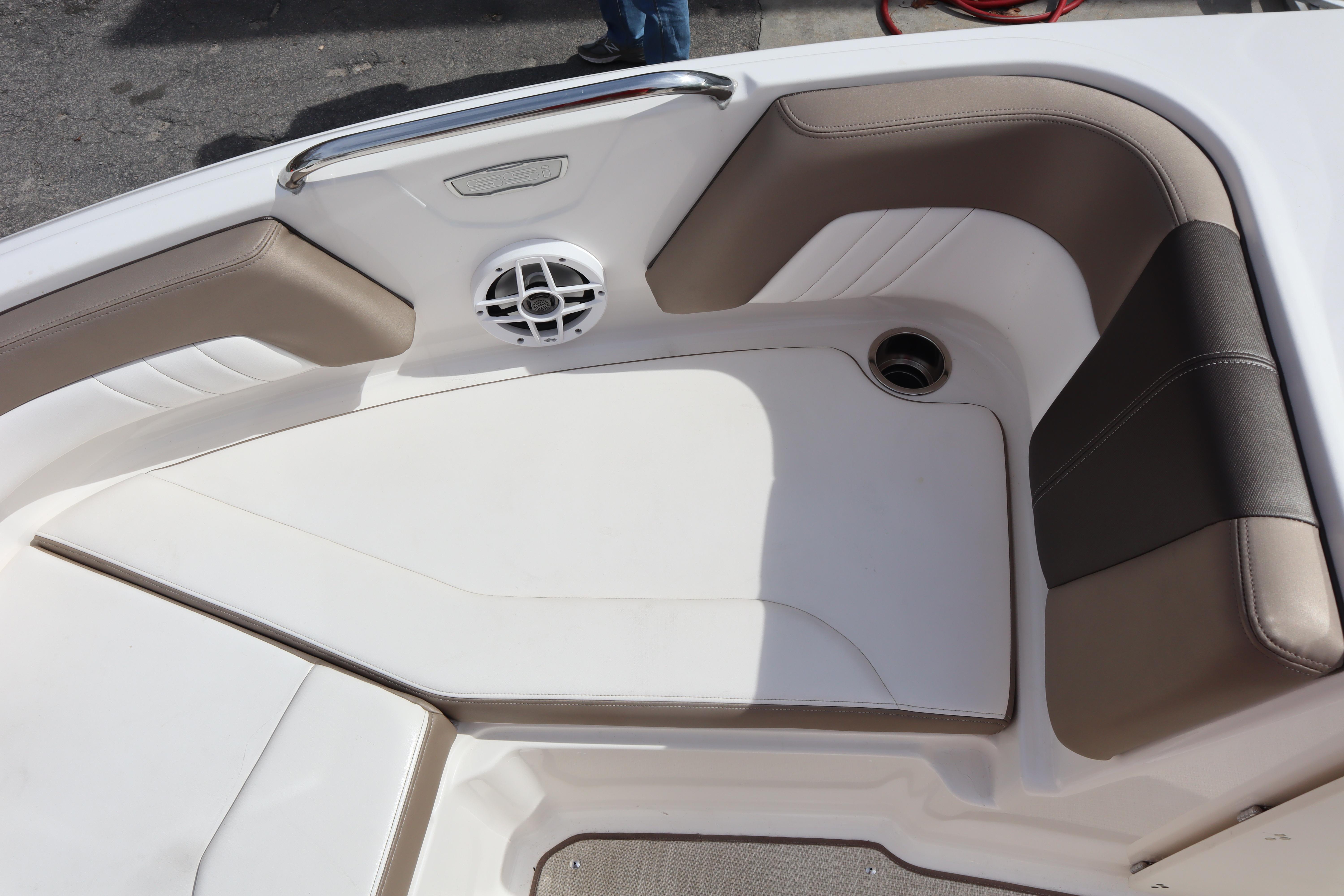 2021 Chaparral 21 SSi boat interior with cushioned seating and speaker.