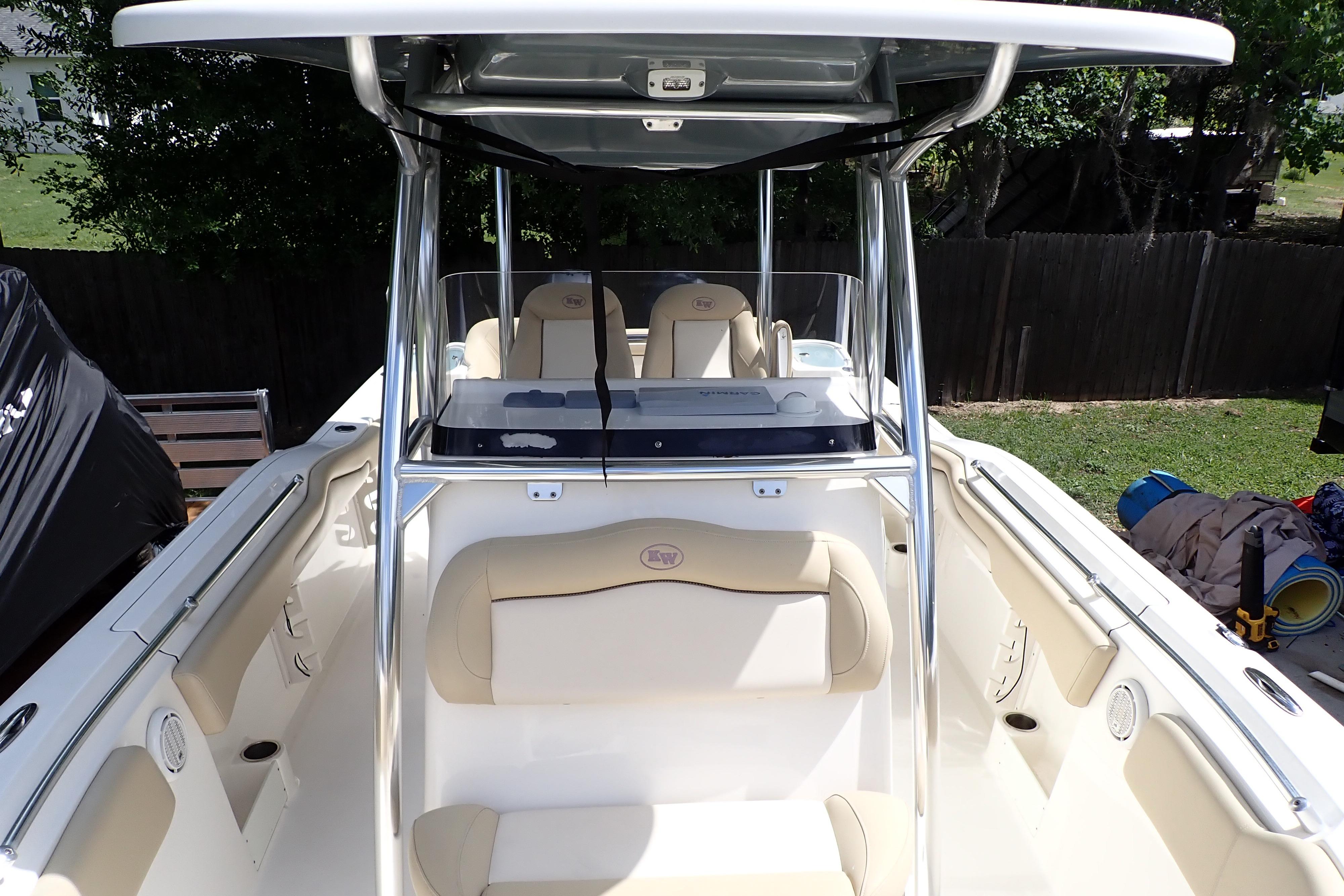 2019 Key West 263 FS boat interior with seating and console, parked outdoors.