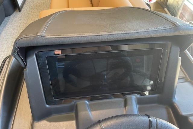 Dashboard of 2026 Regency 230 DL boat with touchscreen display.