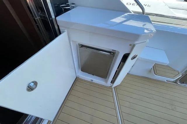 2016 Sea Ray Sundancer 510 yacht with open storage compartment on deck.