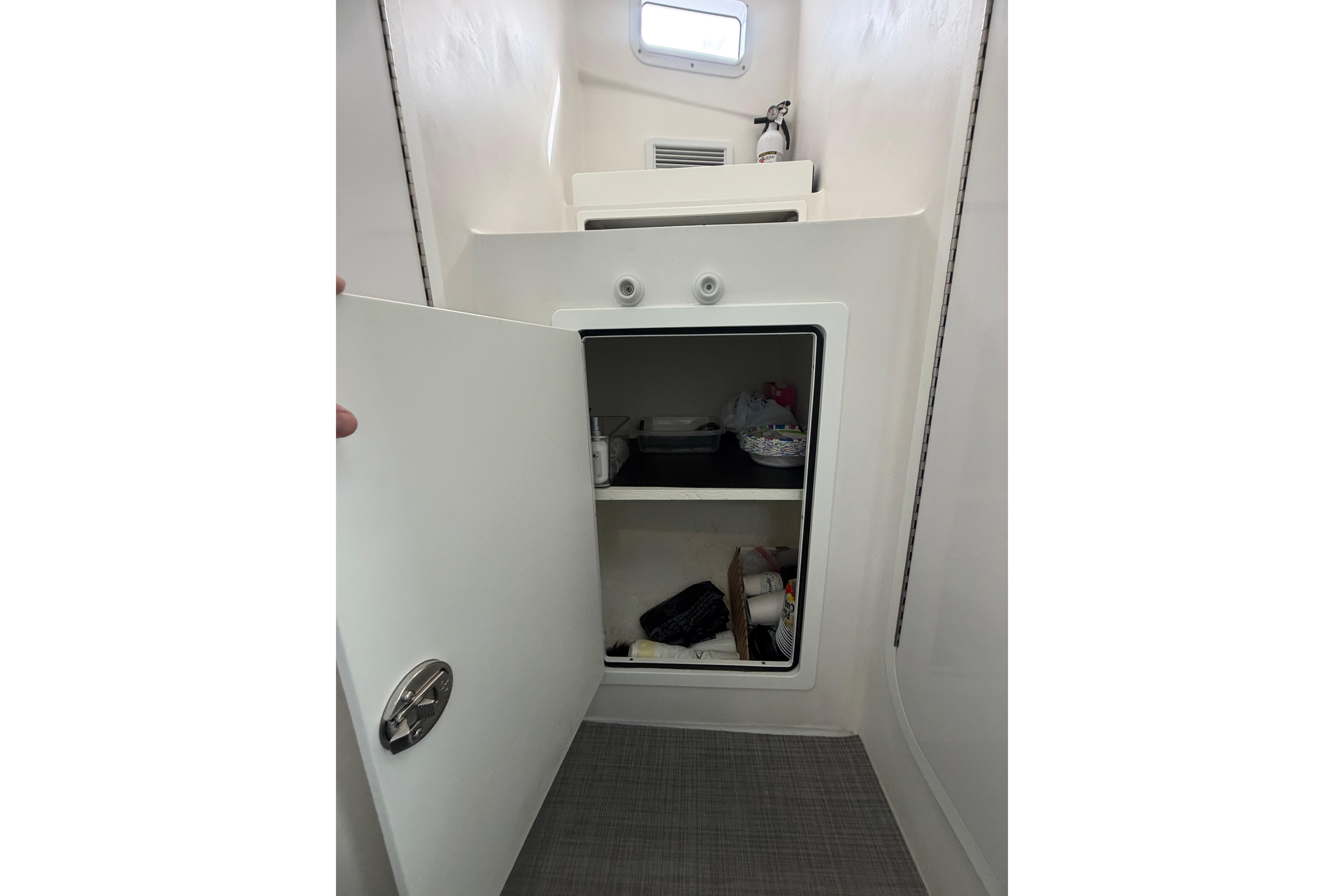 Interior storage compartment on a 2018 H&H Marine Osmond Beal boat.