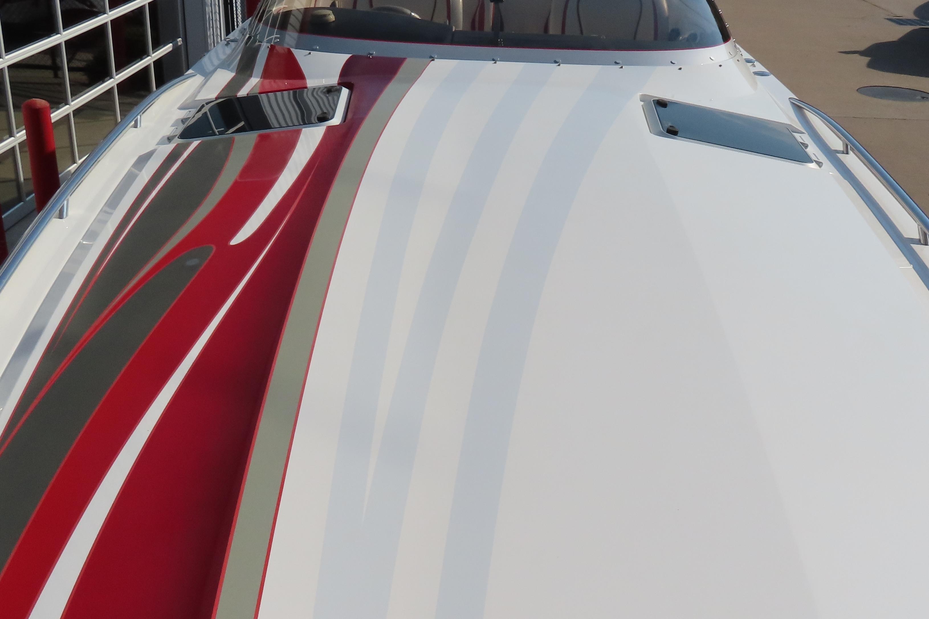 2013 Nordic 39 Poker Run boat with sleek red and white design on deck.
