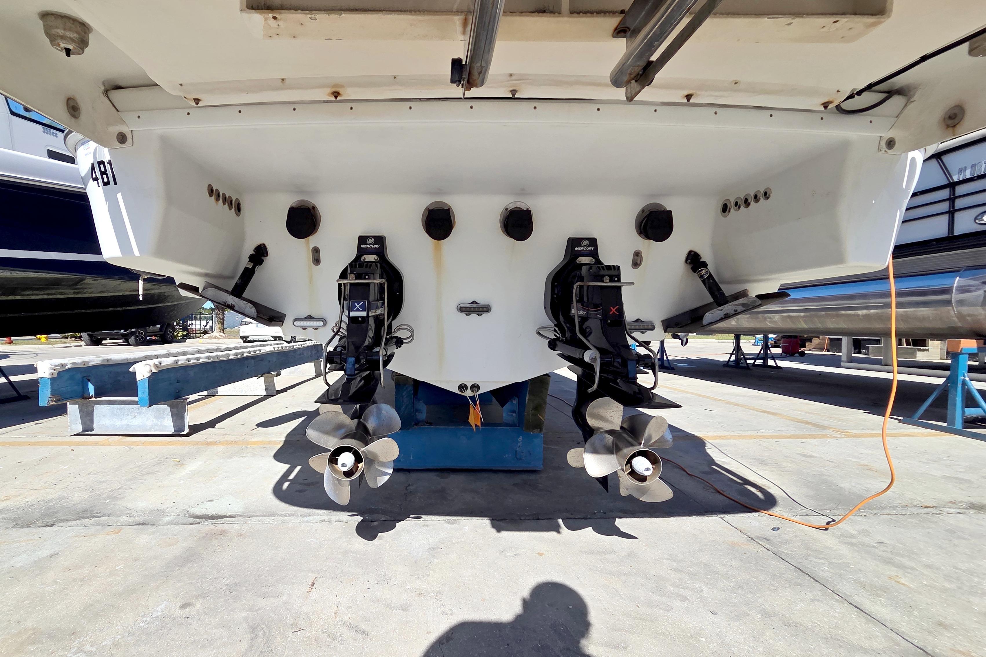 2015 Formula 350 Crossover Bowrider boat with dual propellers in dry dock.