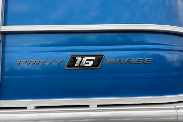 2026 Sun Tracker Party Barge 16 DLX, blue exterior with model emblem.