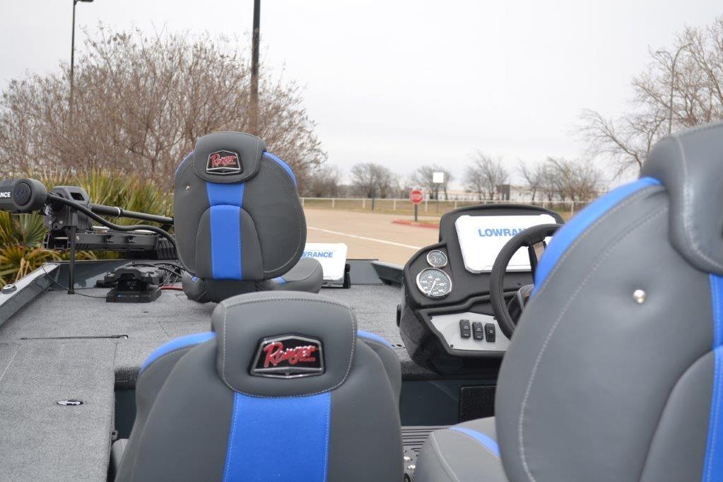 2026 Ranger RT178C boat interior with blue and gray seats, steering wheel, and dashboard.