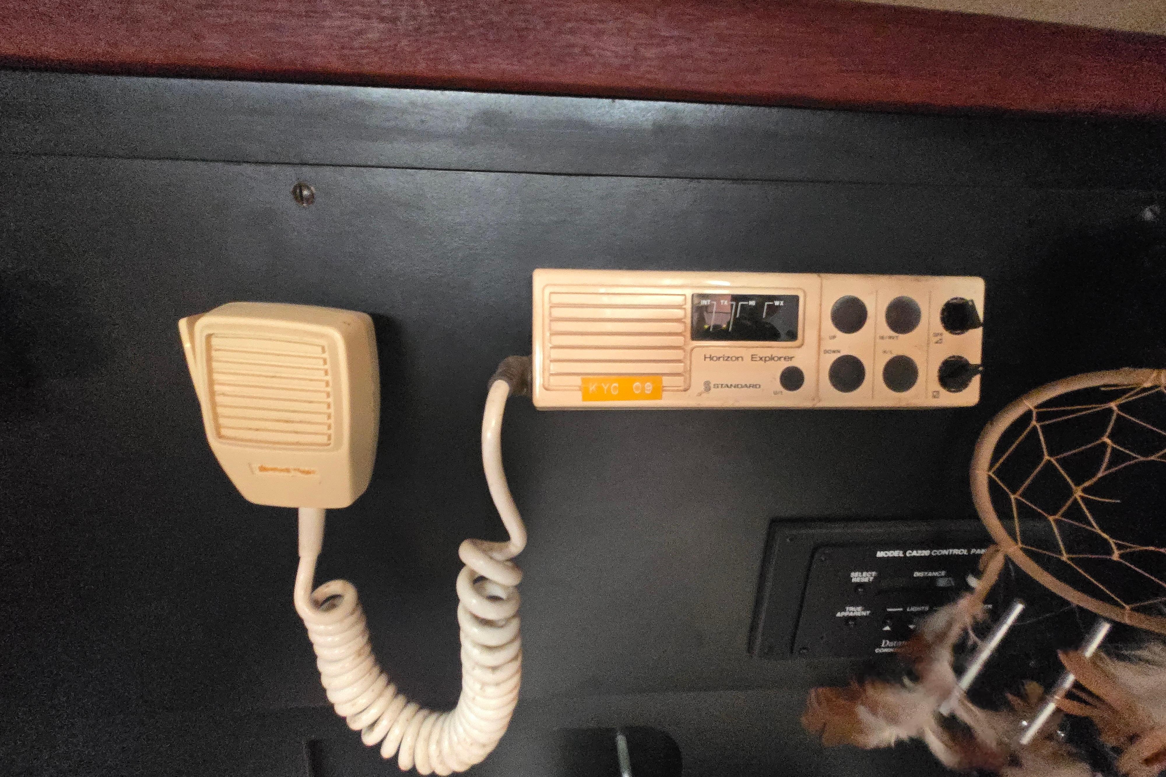 Vintage marine radio setup on a 1988 Sabre 38 sailboat, featuring a Horizon Explorer unit.