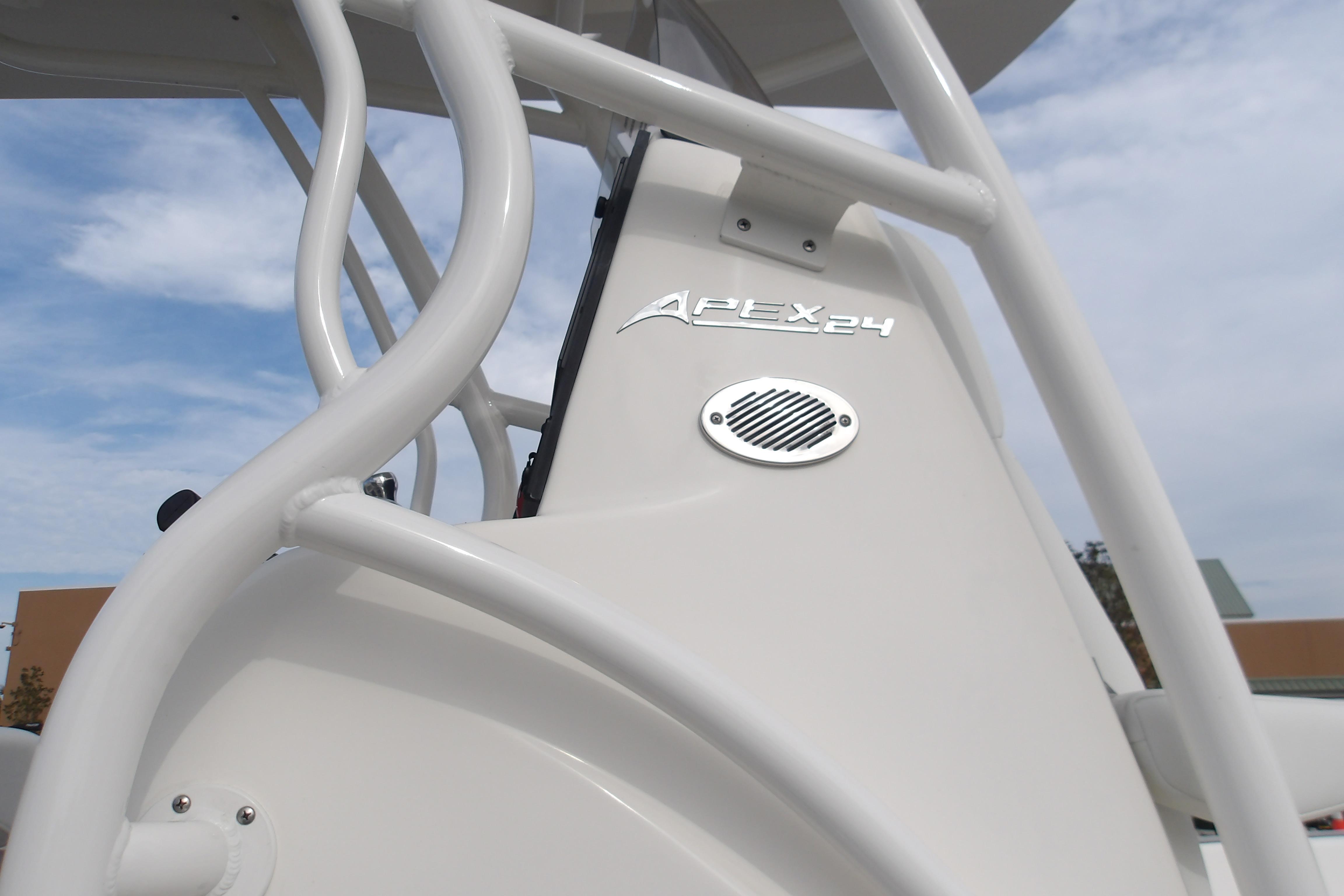 Close-up of 2026 Mako 24 APEX boat structure under a cloudy sky.