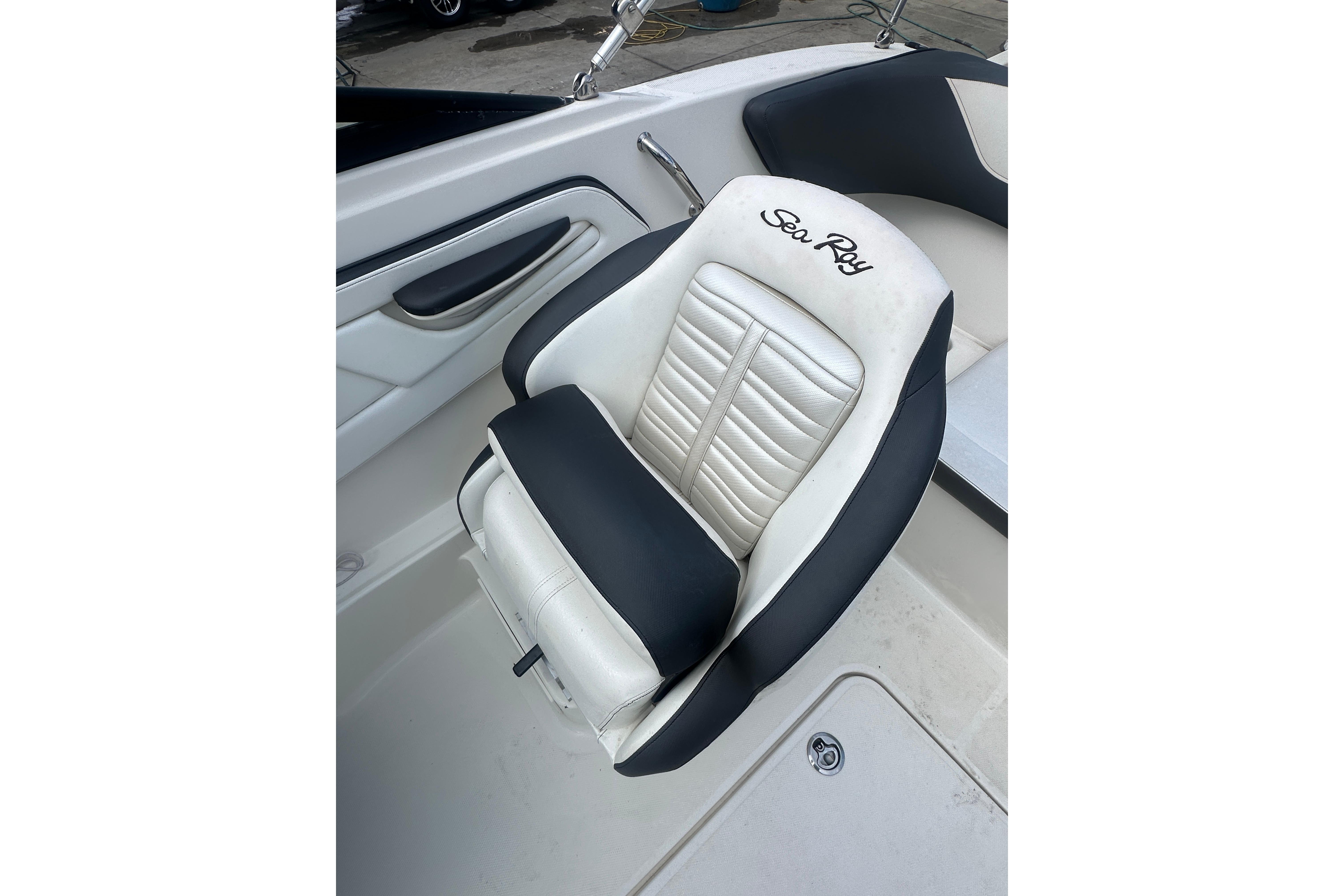 2017 Sea Ray SPX 190 Outboard boat seat, featuring black and white upholstery.