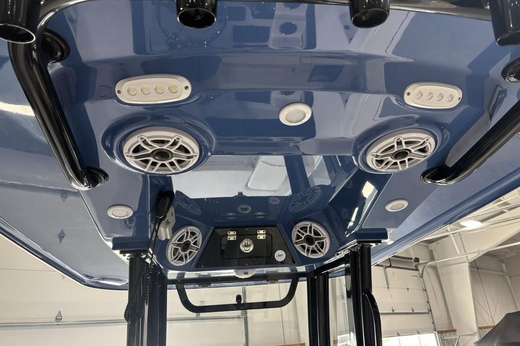 2026 Sportsman Masters 247 Bay Boat T-top with speakers and LED lights.