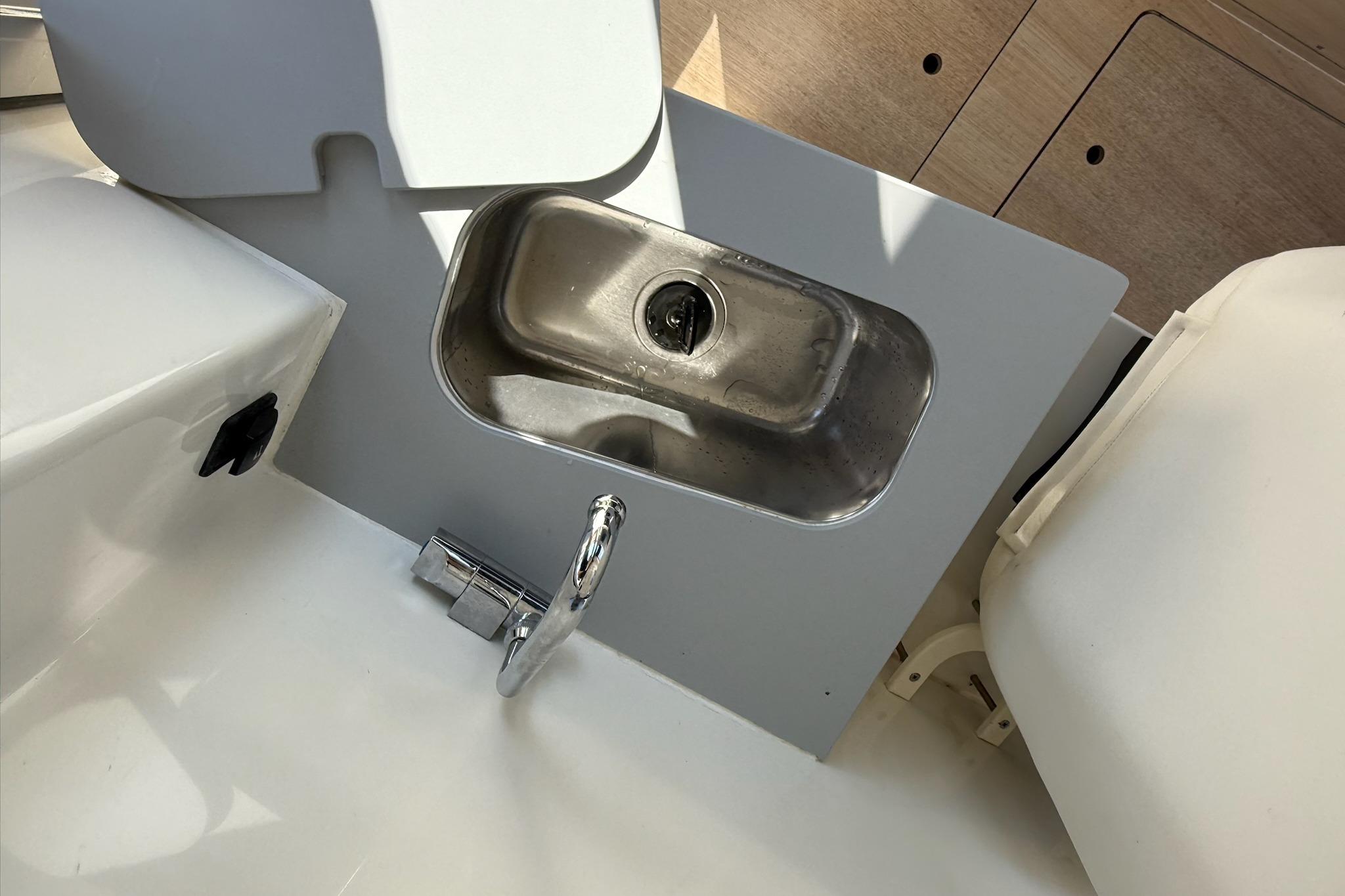 2024 Bayliner Trophy T25 Pilothouse sink and faucet detail.
