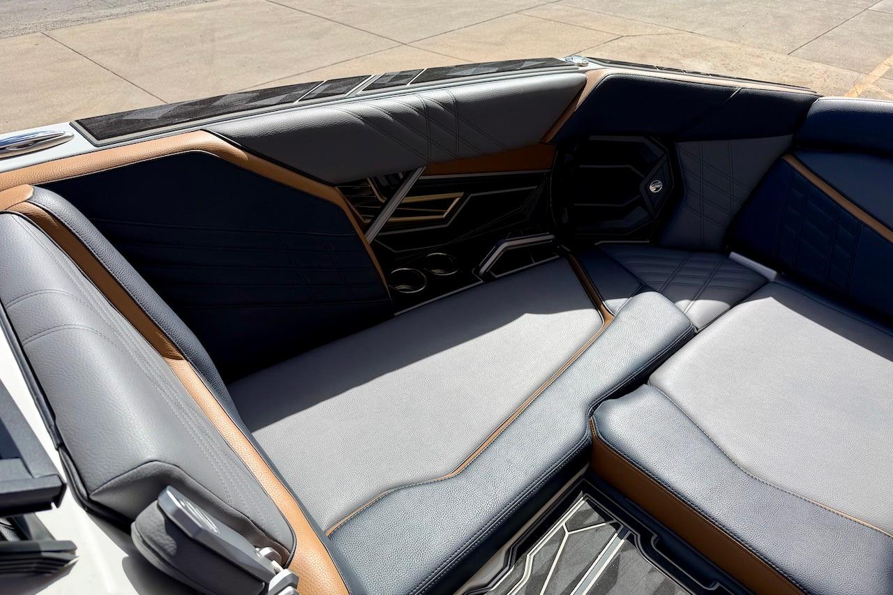 Luxurious interior seating of 2025 Tigé Ultré 25ZX boat, featuring sleek design and premium materials.