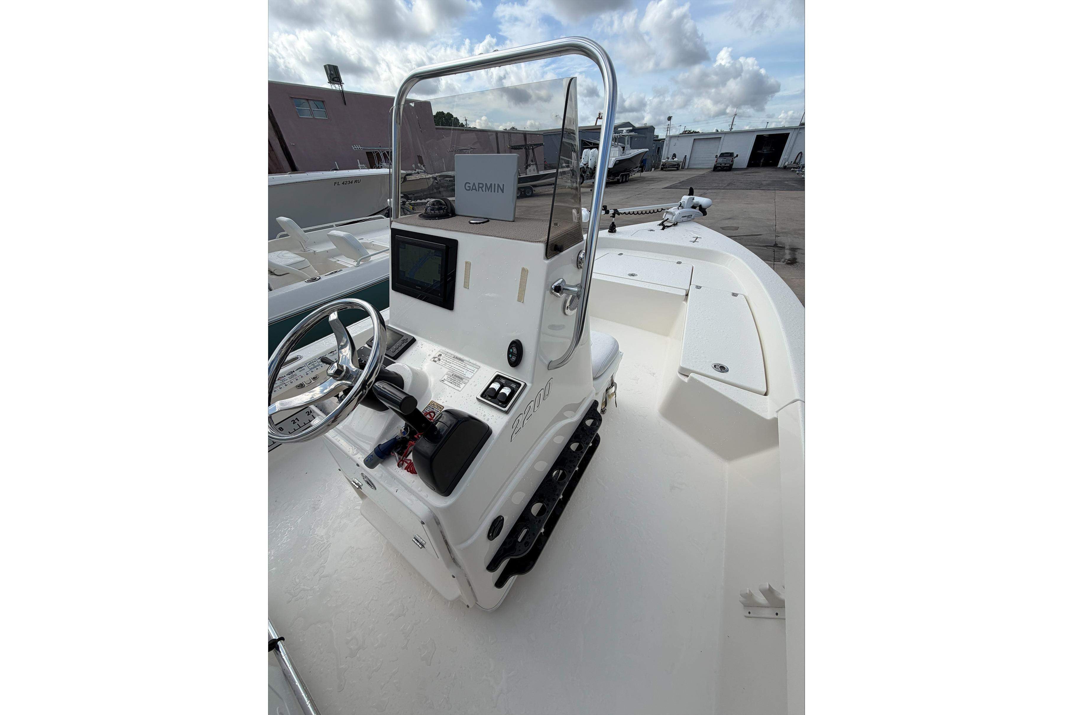 2017 Pathfinder 2200 TRS boat with Garmin navigation, steering wheel, and spacious deck.