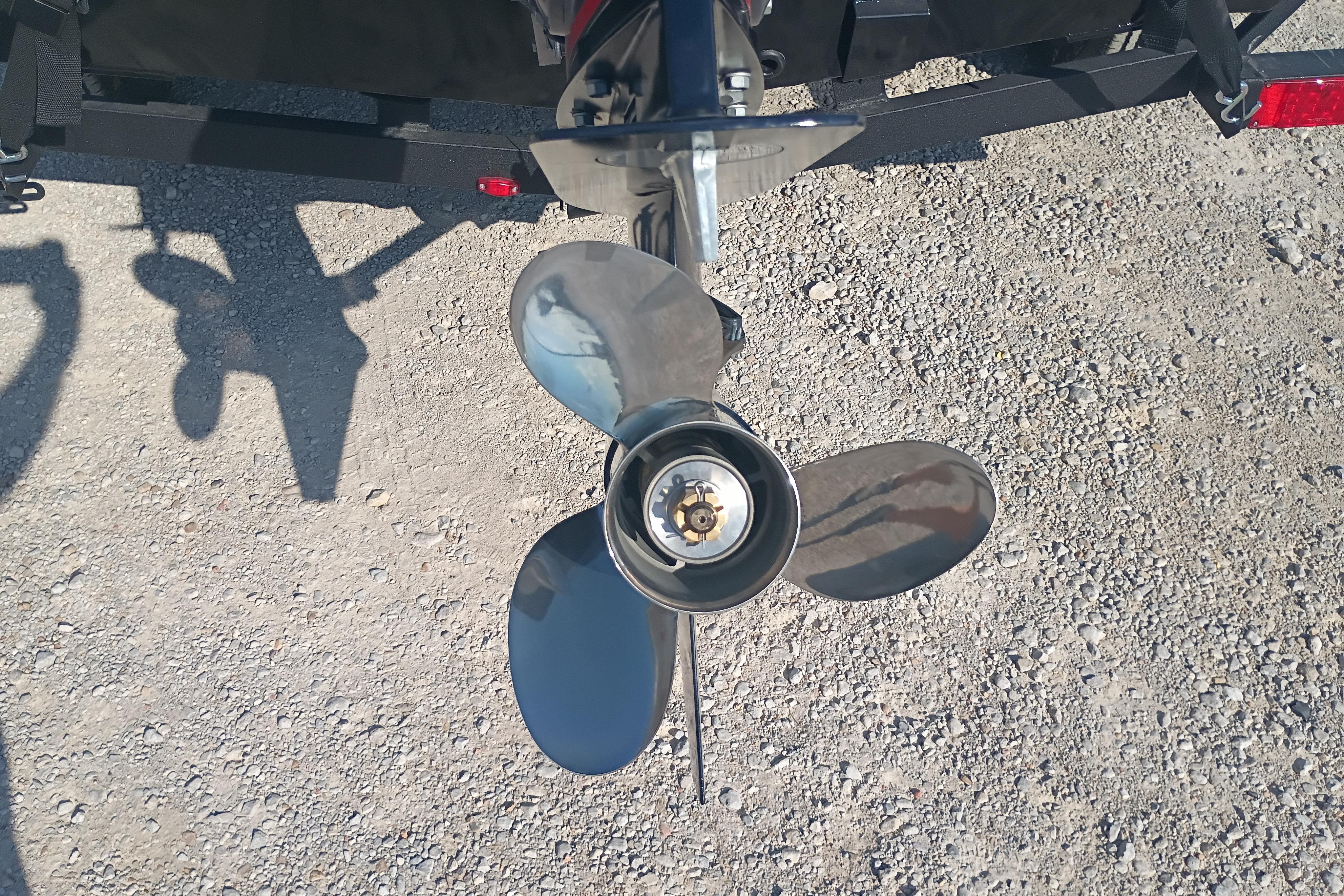 Propeller of 2026 G3 1810SE boat on gravel surface.