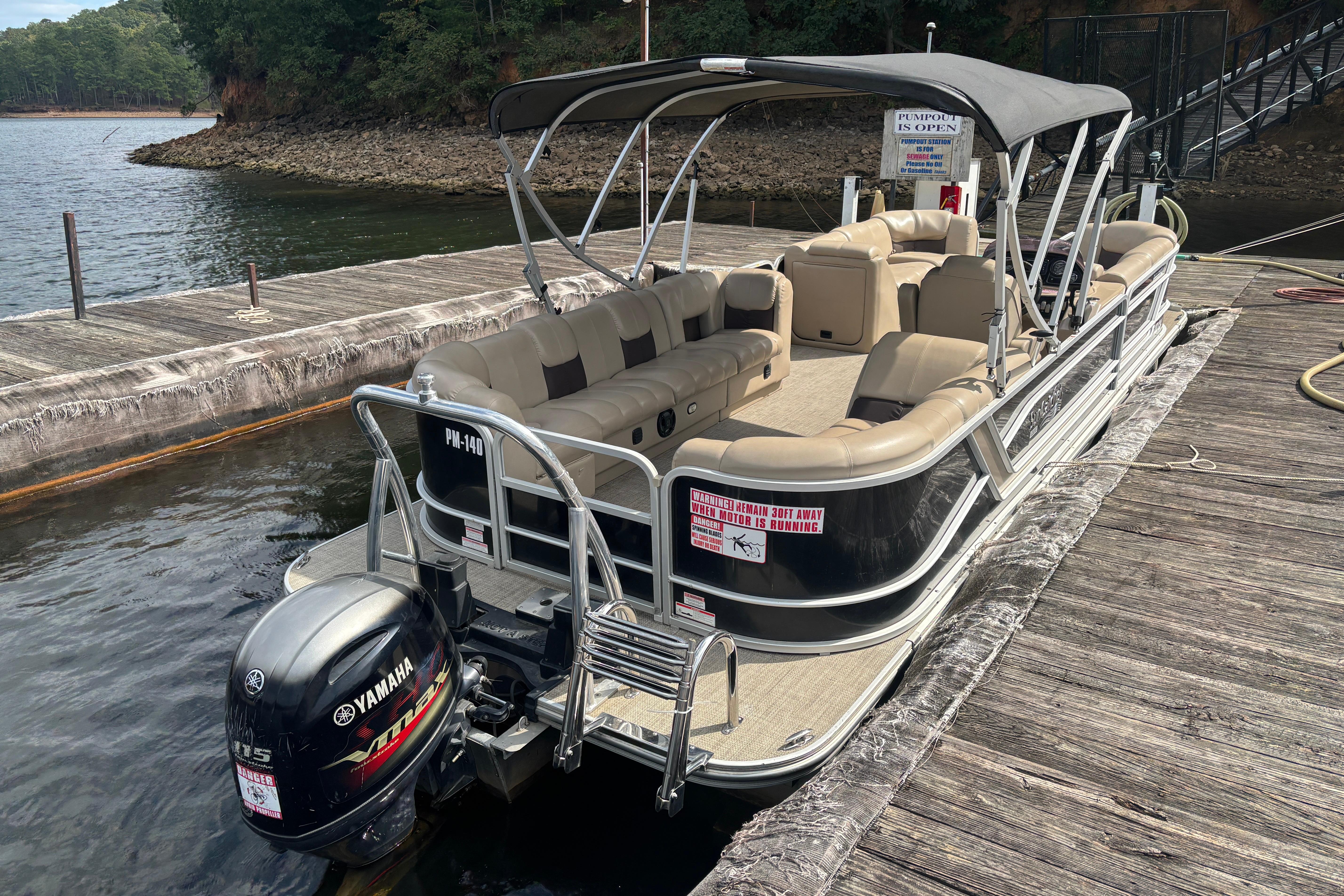 2021 SunCatcher Fusion 325RCX pontoon boat docked, featuring Yamaha outboard motor.