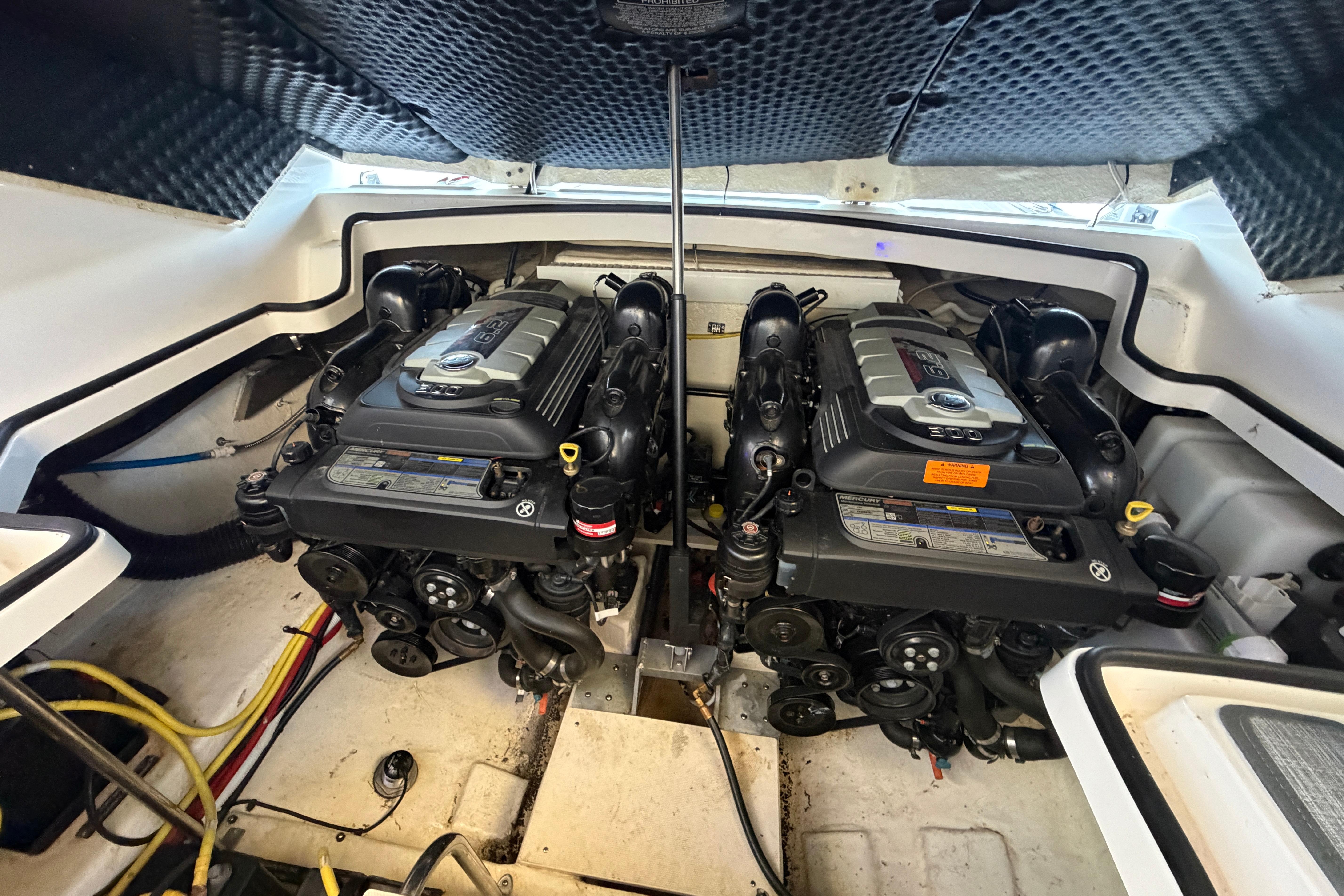 Engine compartment of a 2018 Chaparral 347 SSX boat, featuring dual engines.