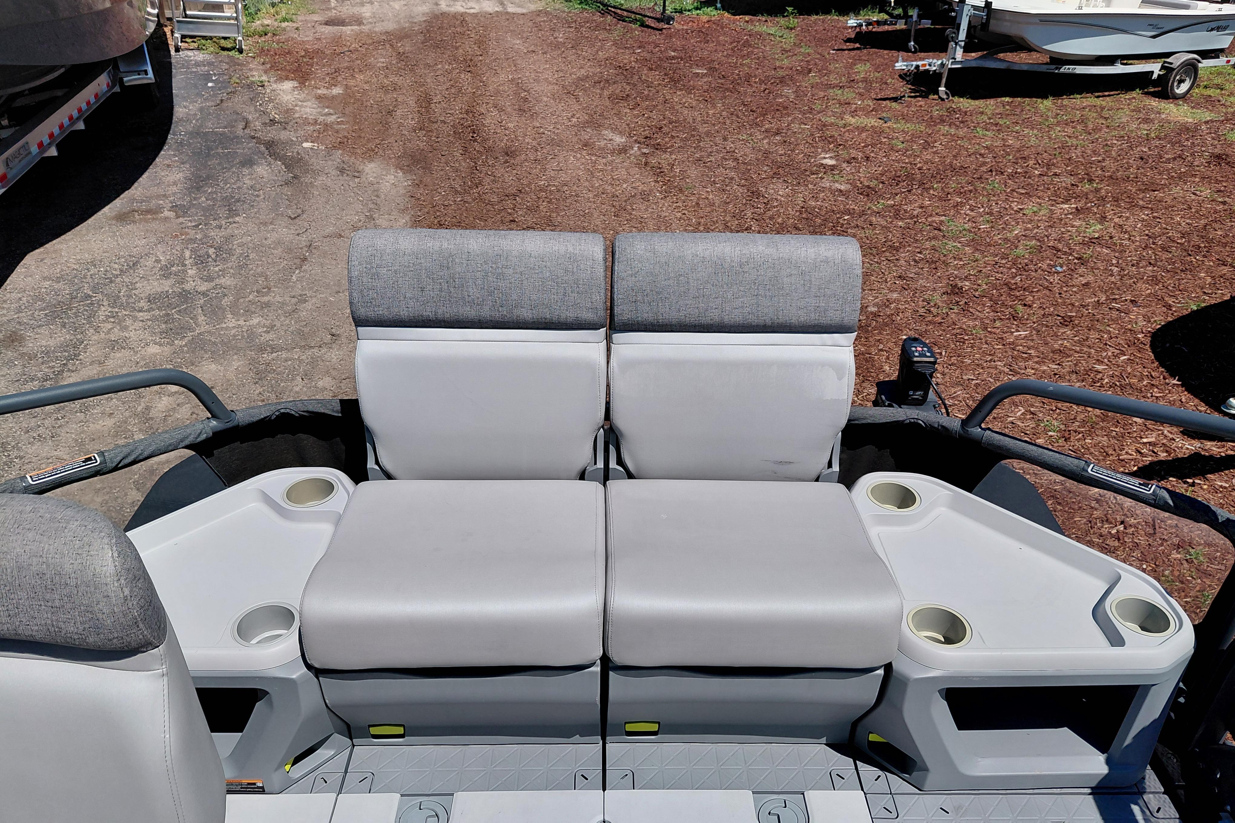 2024 Sea-Doo Switch Cruise 18 interior seating with cup holders, showcasing comfort and functionality.